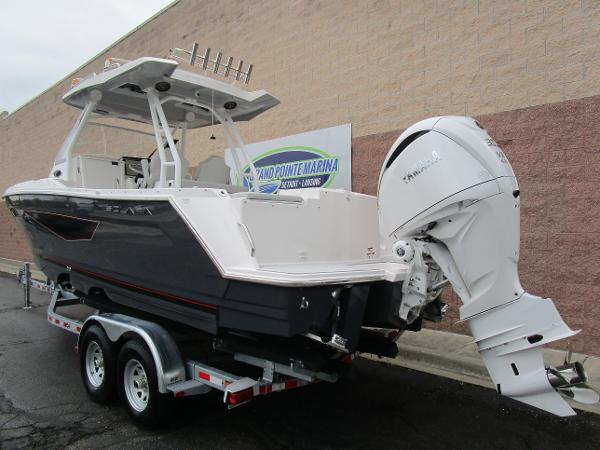 2025 Solara S-250 CW boat on trailer, featuring powerful outboard motor.