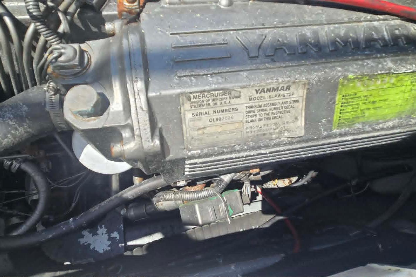 Yanmar engine in a 2003 True World Marine 286 boat, showcasing model and serial details.