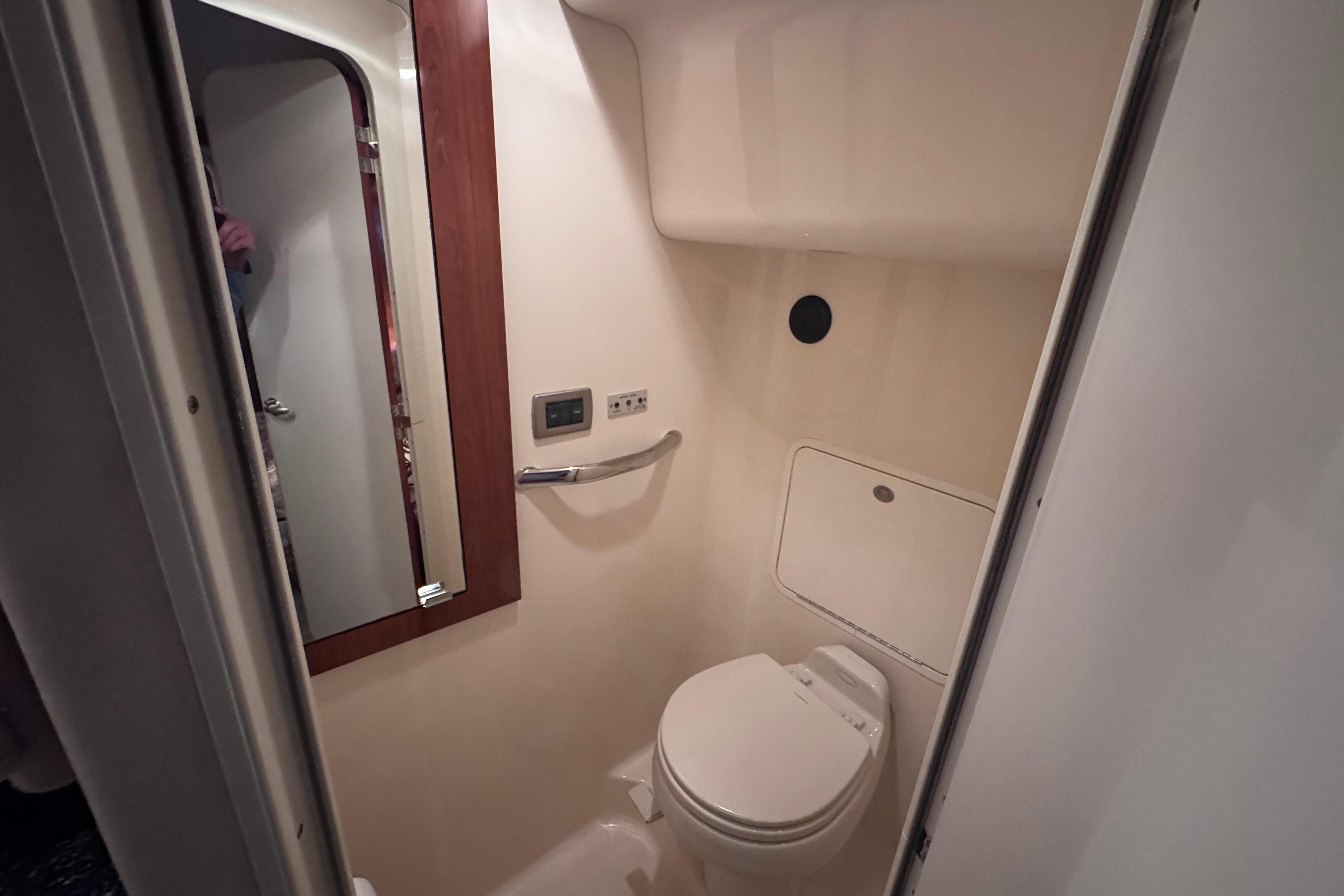 2004 Sea Ray 390 Motor Yacht bathroom interior with toilet and mirror.