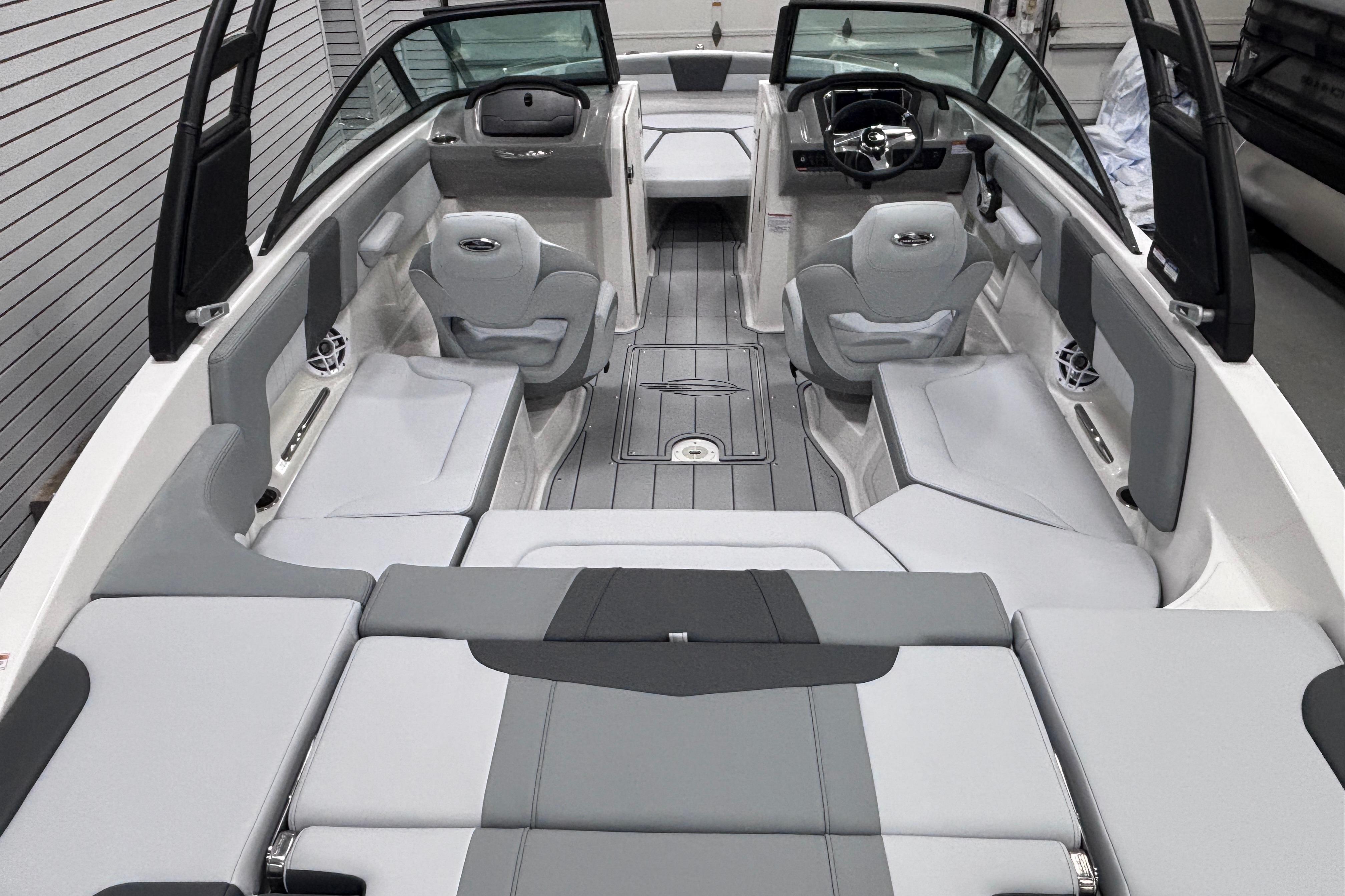 2026 Chaparral 23 SSi boat interior with sleek gray seating and modern dashboard design.