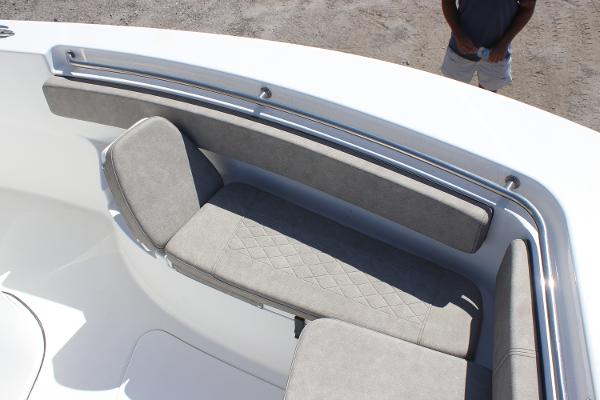 2023 Sea Pro 239 Center Console boat with cushioned seating area.