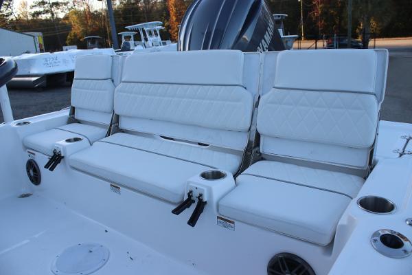 2025 Sea Fox 231 Bay Fox boat seating with white cushions and cup holders.