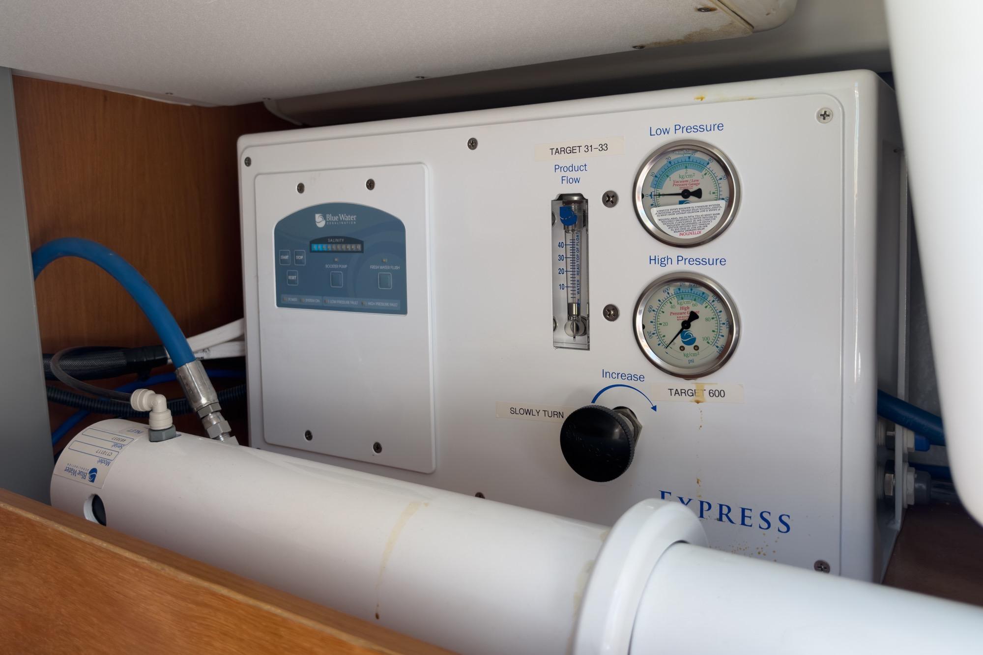 Control panel of a 2017 Beneteau Sense 50 yacht, featuring pressure gauges and tubing.