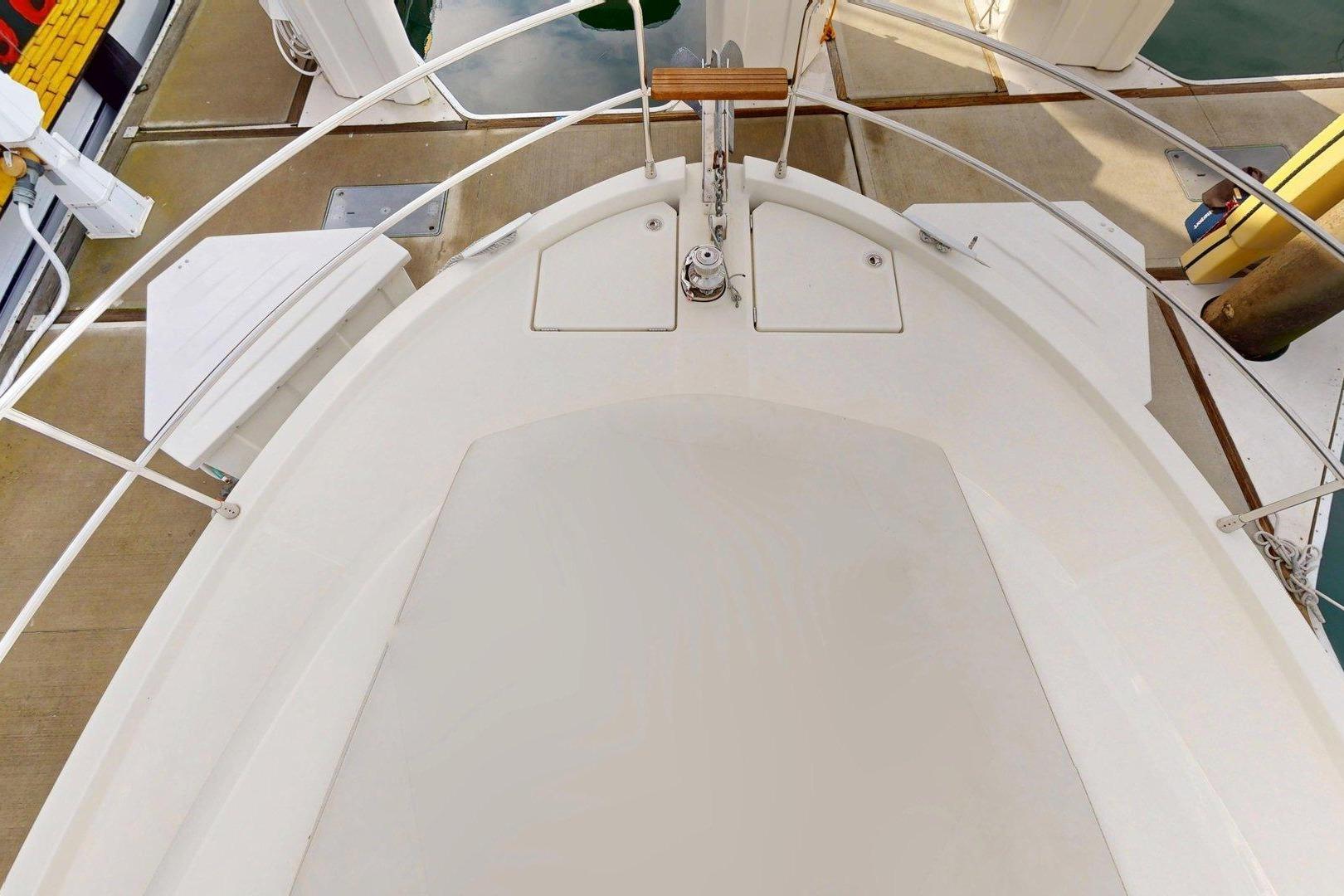 2021 Beneteau Swift Trawler 35 bow view, showcasing deck and railing details.