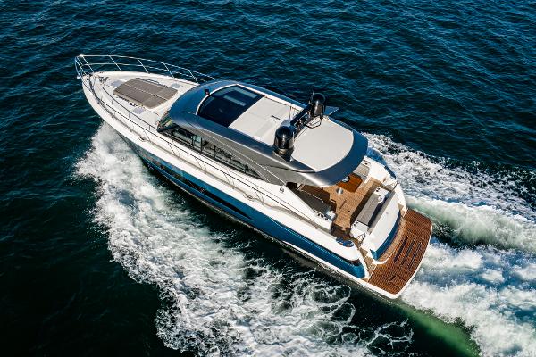 2021 Riviera 5400 Sport Yacht cruising on open water.