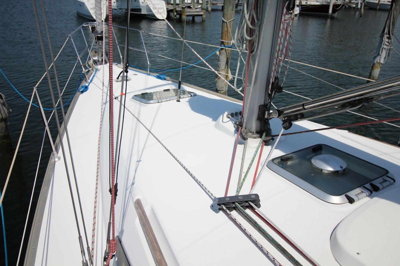 Deck view of 2004 Jeanneau Sun Odyssey 35 sailboat in marina.