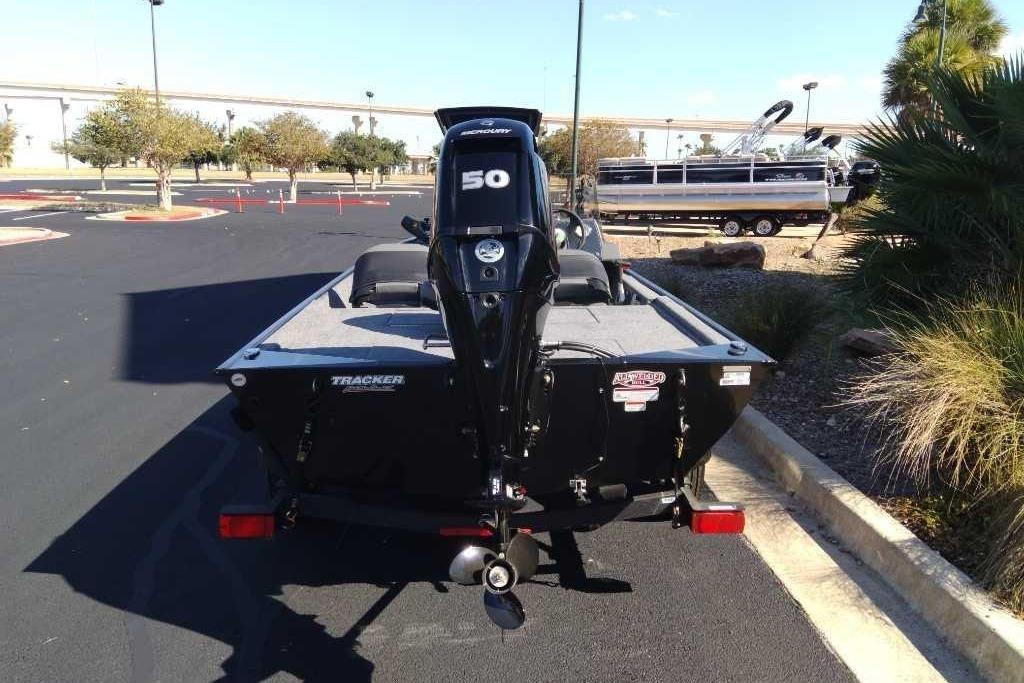 2026 Tracker Bass Tracker Classic XL boat with 50 HP motor in parking lot.