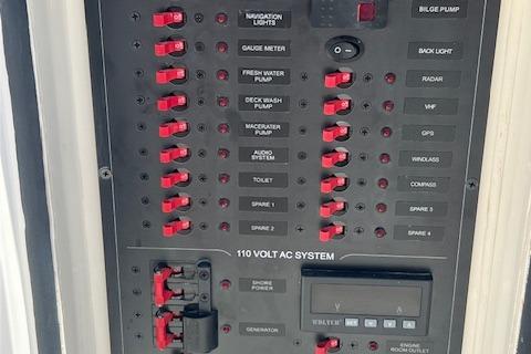 Electrical control panel of a 2024 Bracewell 25 boat with labeled switches and indicators.