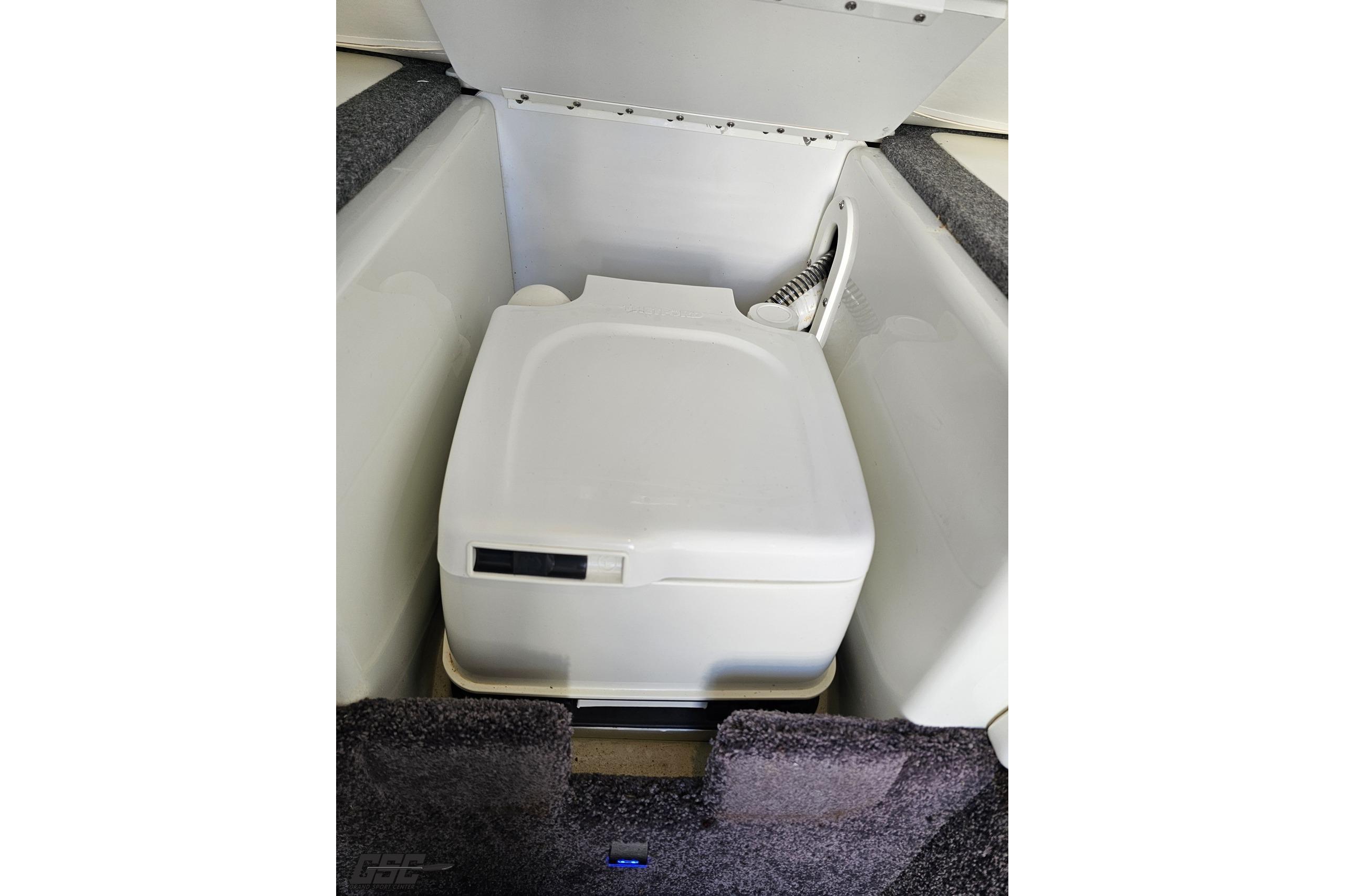 Portable toilet in 2014 Formula 292 FASTech boat interior.