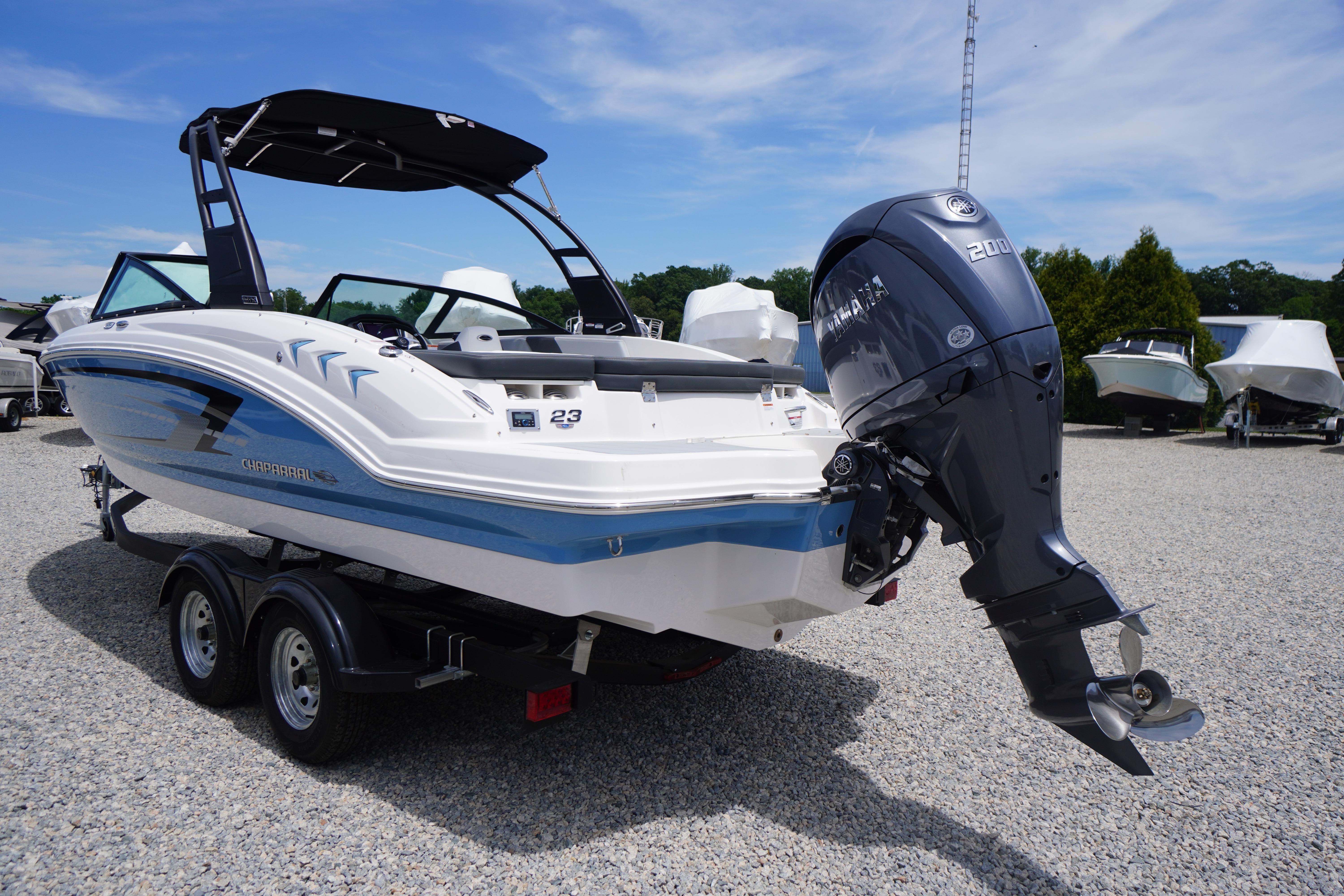 Chaparral 23 SSi OB 2026 boat with Yamaha outboard motor on trailer.