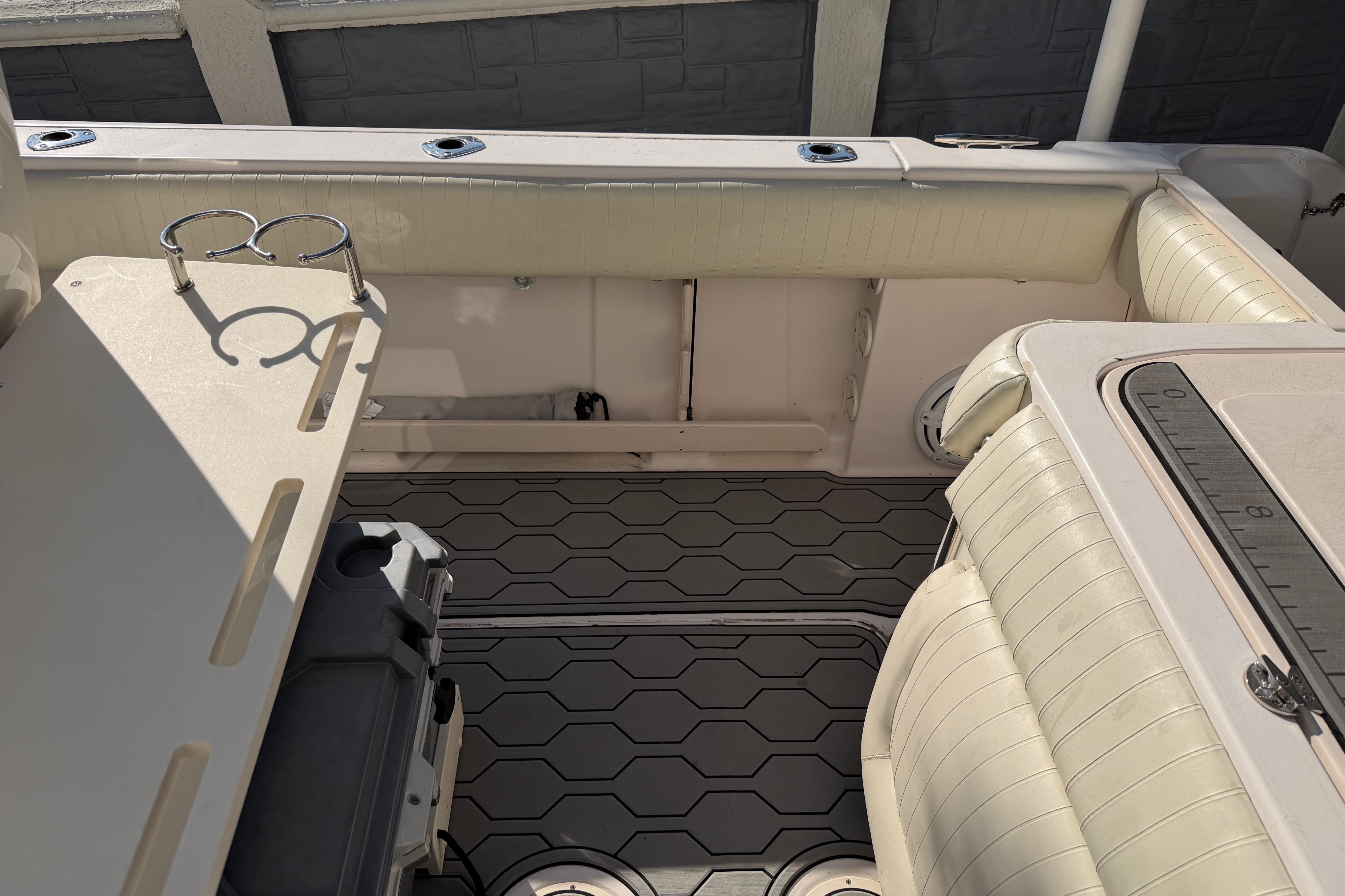 2004 Grady White 273 boat interior with seating and rod holders.