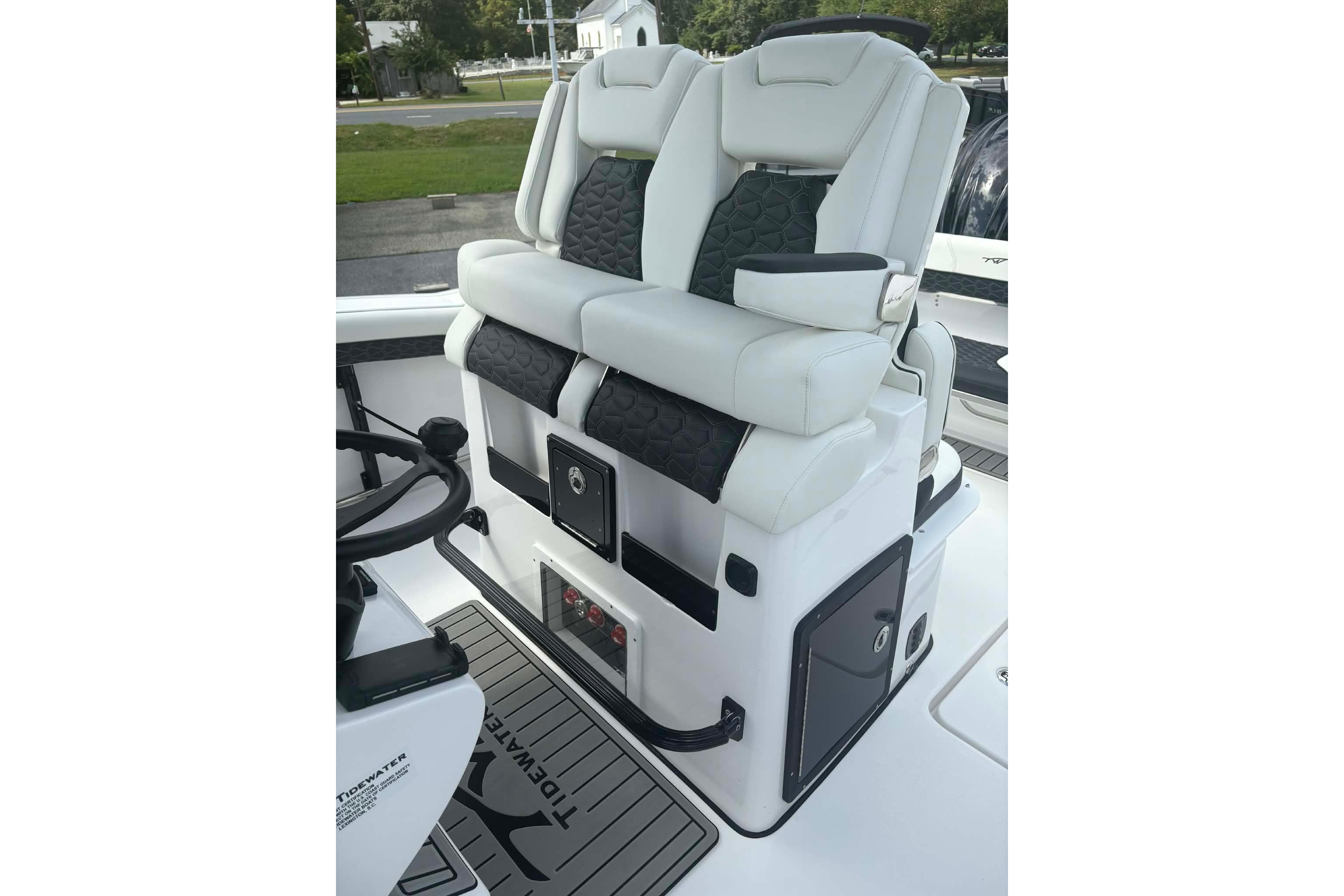 Luxury seating on 2026 Tidewater 282 CC Adventure boat, featuring sleek design and comfort.