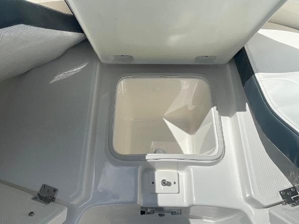 2023 Robalo R270 storage compartment with open lid.