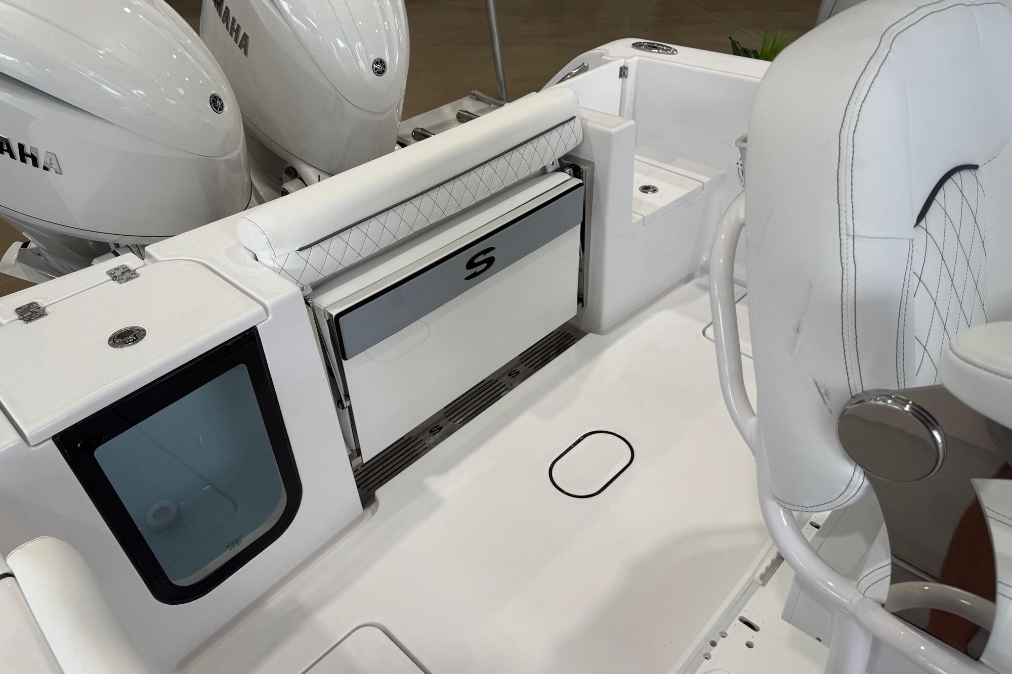 2026 Sportsman Open 252 Center Console boat interior with Yamaha engines and seating.