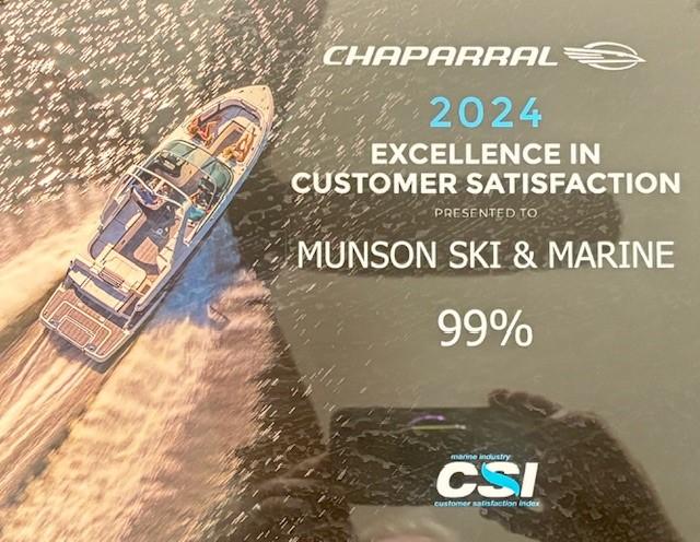 Chaparral SSX 6 boat on water, 2024 Customer Satisfaction Award, Munson Ski & Marine, 99% rating.