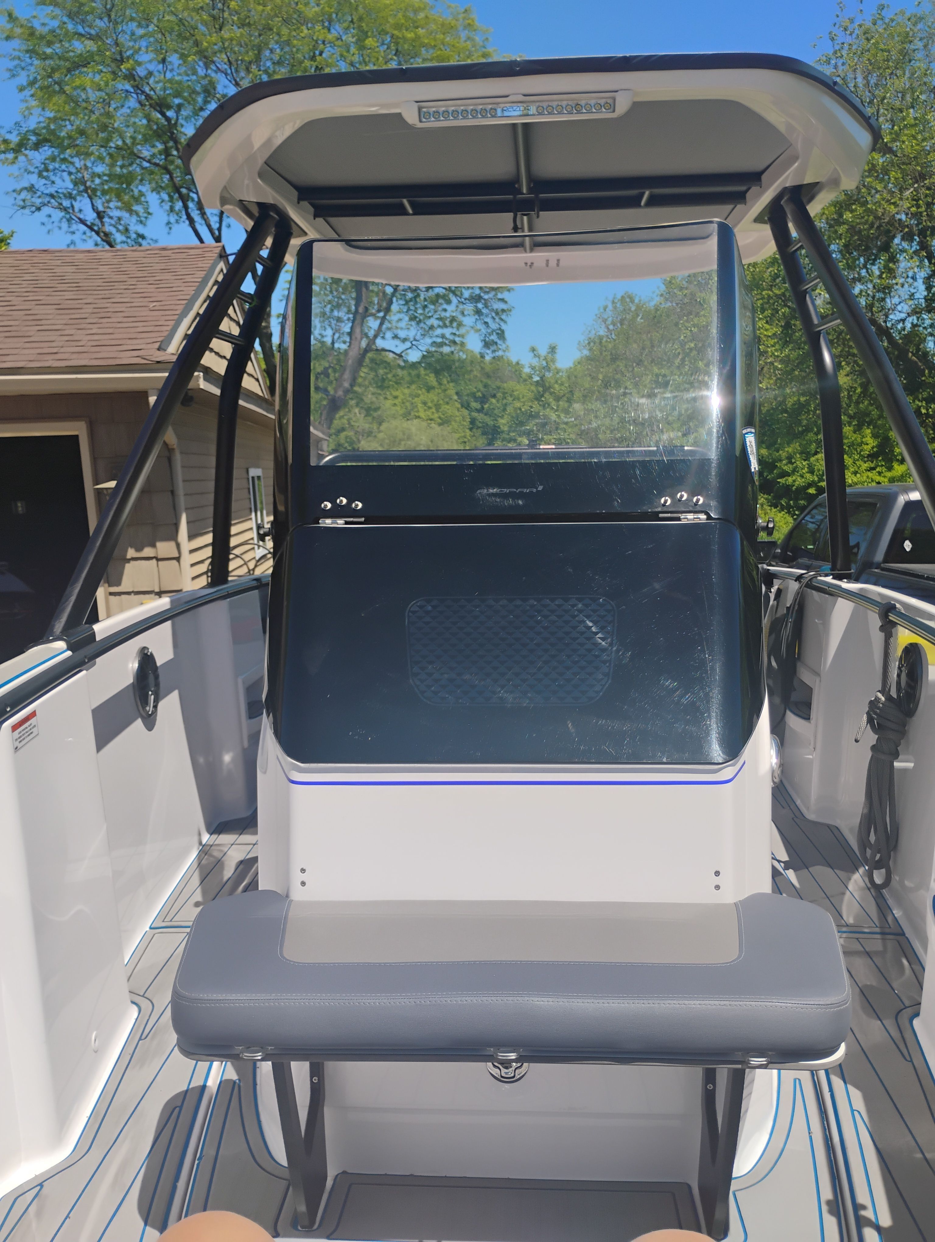 Axopar 22 T-Top 2022 boat with T-top and seating bench.
