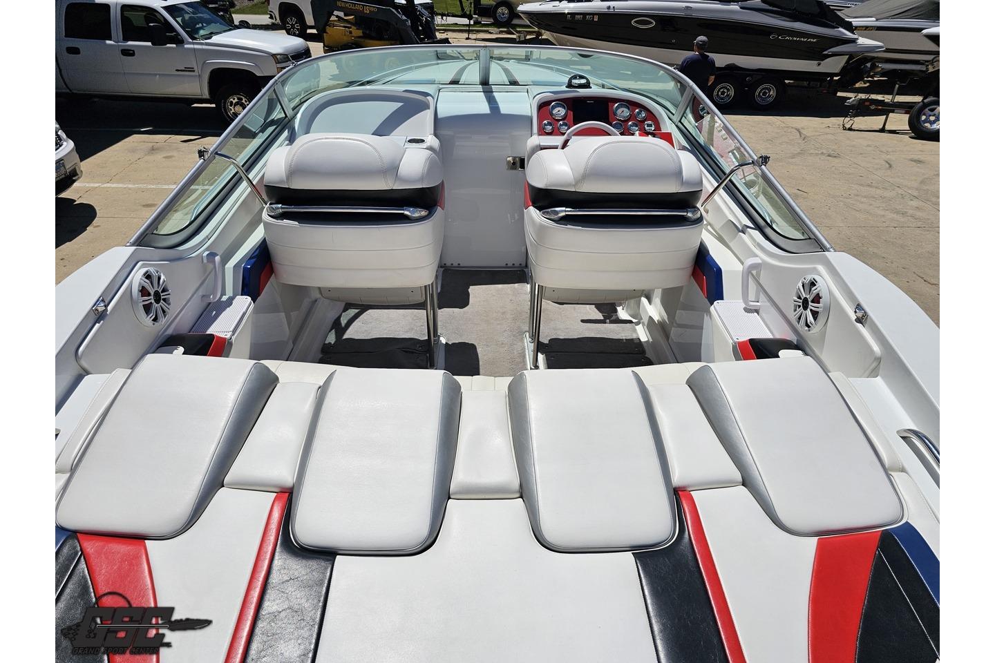 2005 Formula 271 FASTech boat interior with white, red, and black seating.