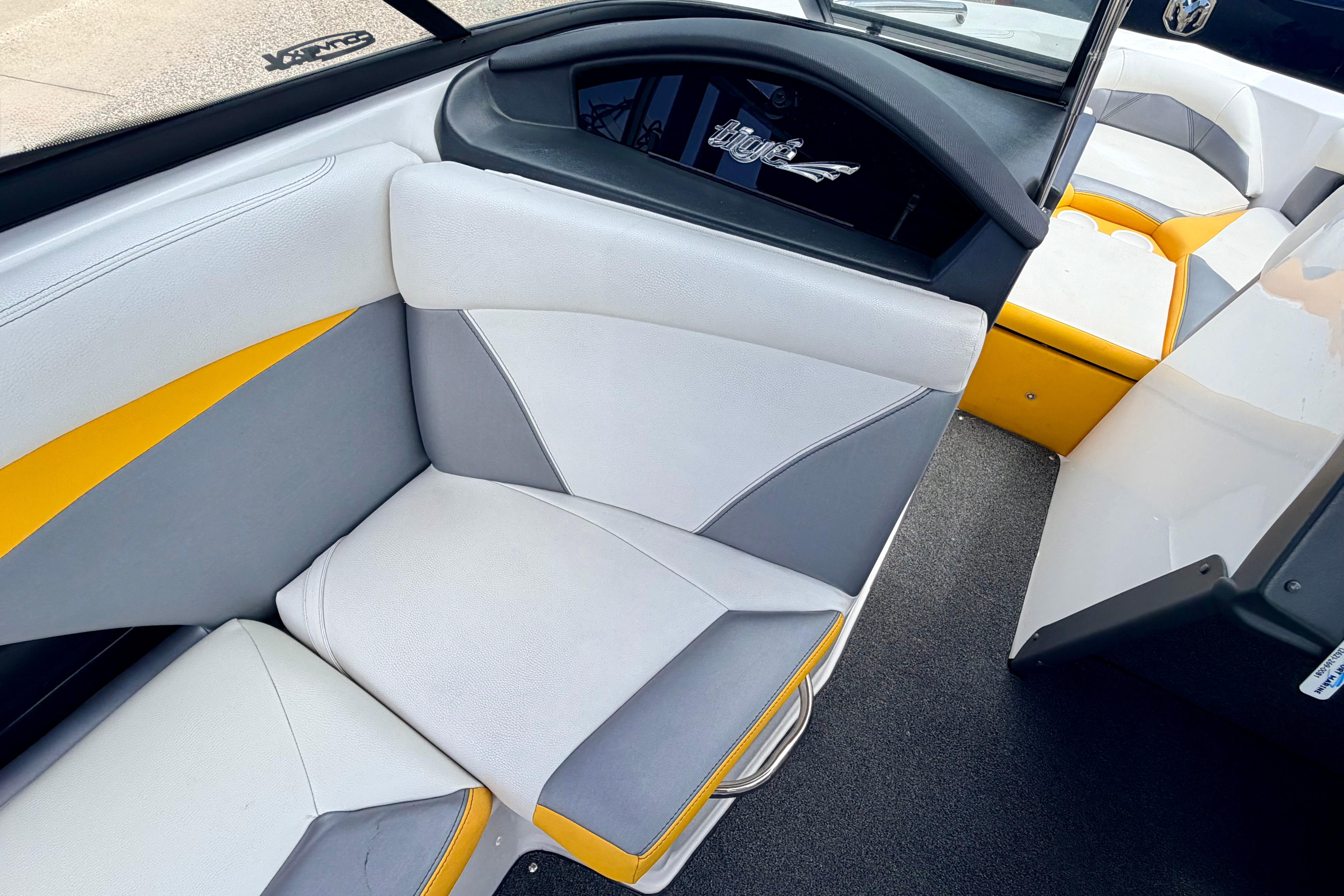2014 Tigé R20 boat interior with white, gray, and yellow seating.
