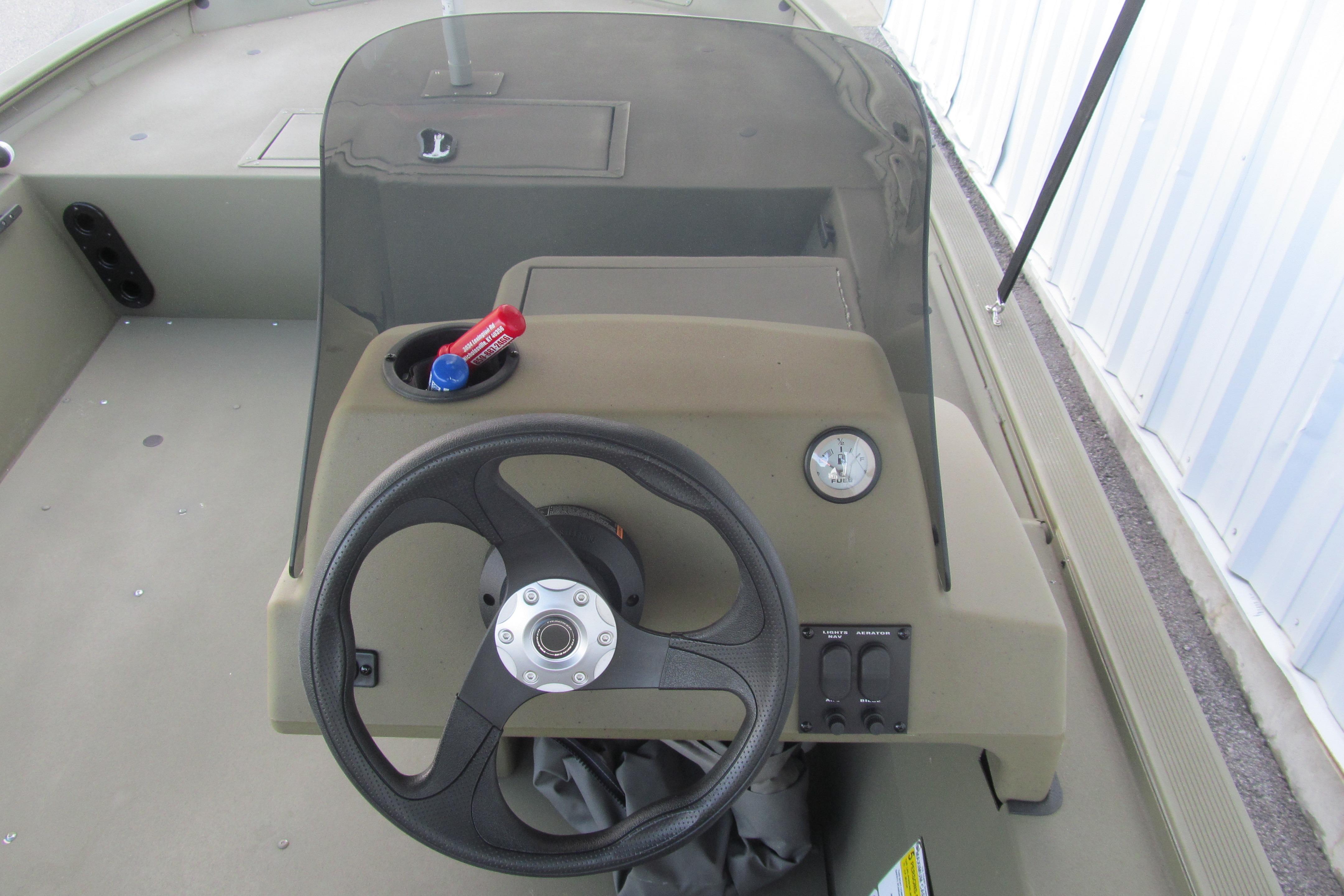 2018 Tracker Grizzly 1754 SC boat console with steering wheel and gauge.