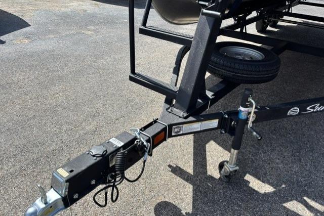 Trailer hitch of 2026 Sun Tracker Fishin' Barge 22 DLX on asphalt surface.