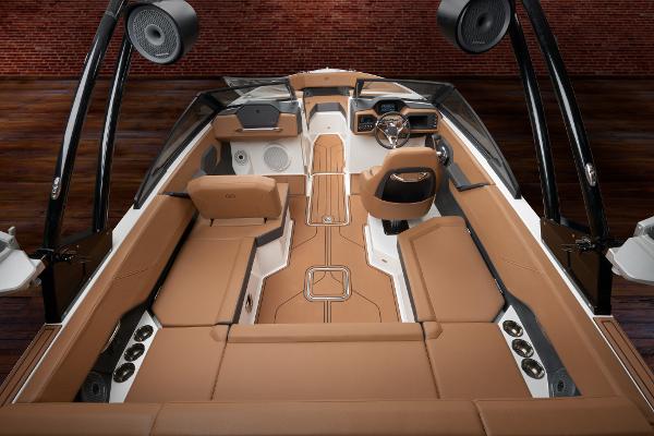 Luxurious interior of 2025 Cobalt CS23 boat with tan leather seating and modern dashboard.