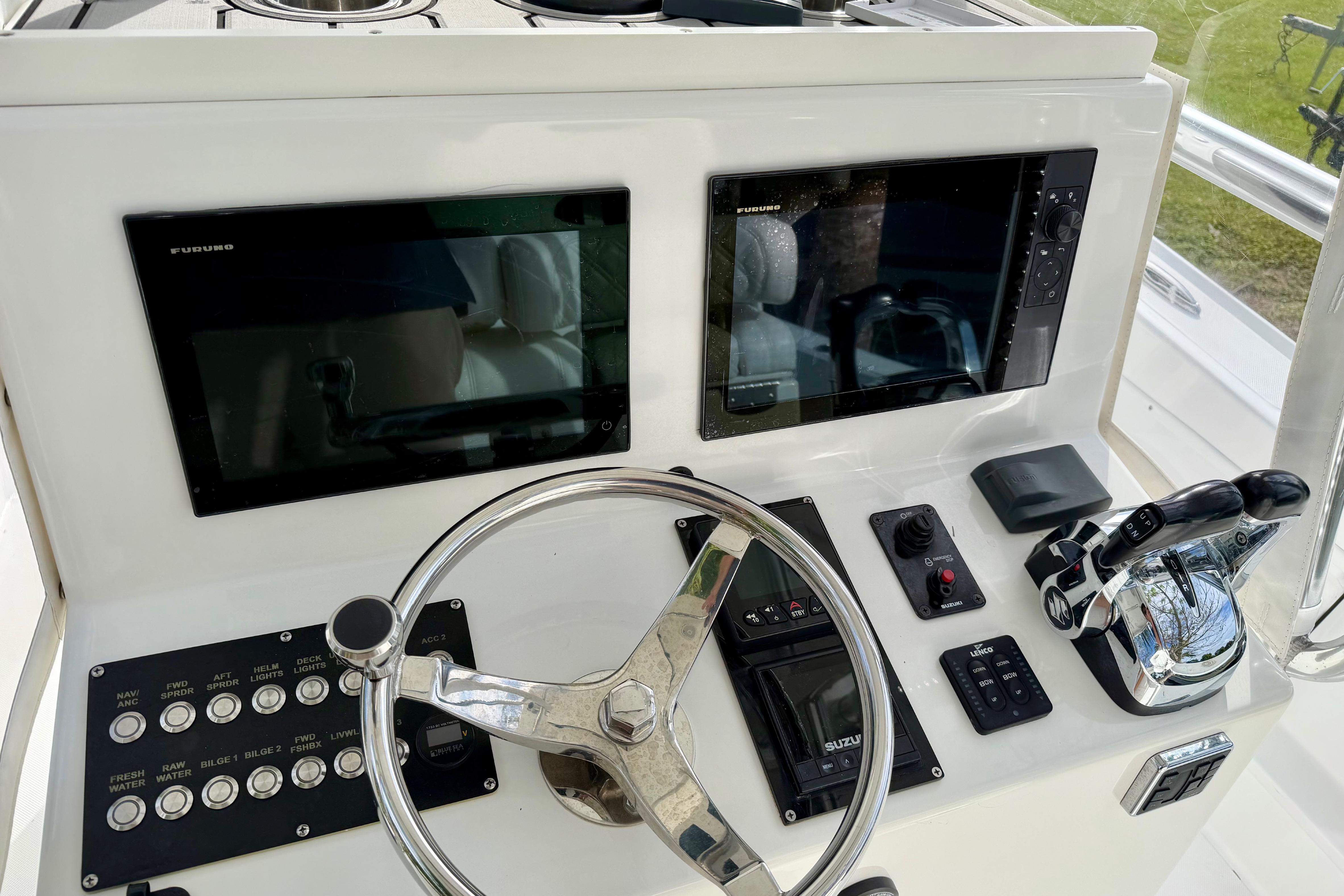 2025 Ocean Master 296 Center Console helm with dual screens and modern controls.