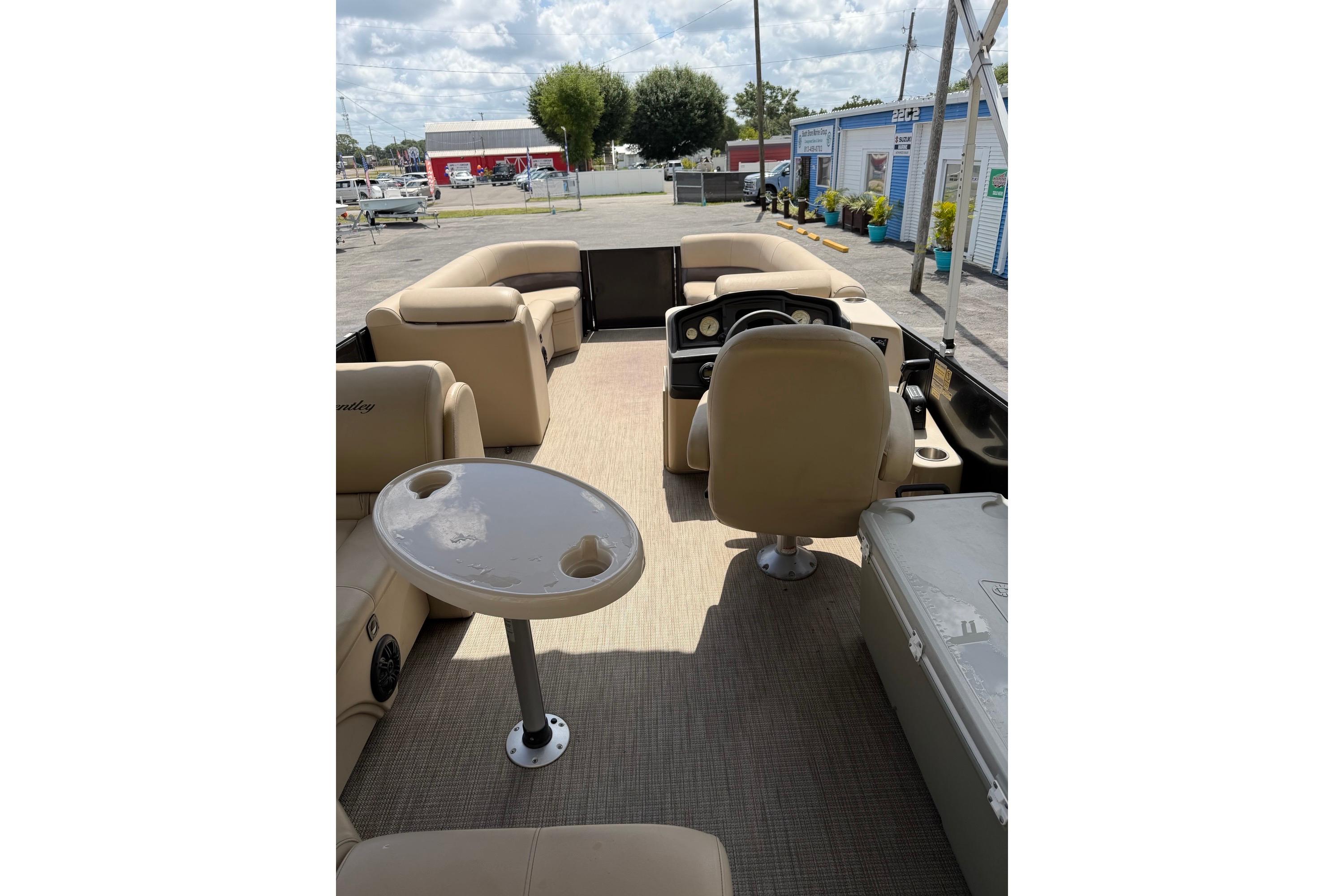 2022 Bentley Pontoons 240 CRUISE interior with beige seating and steering console.