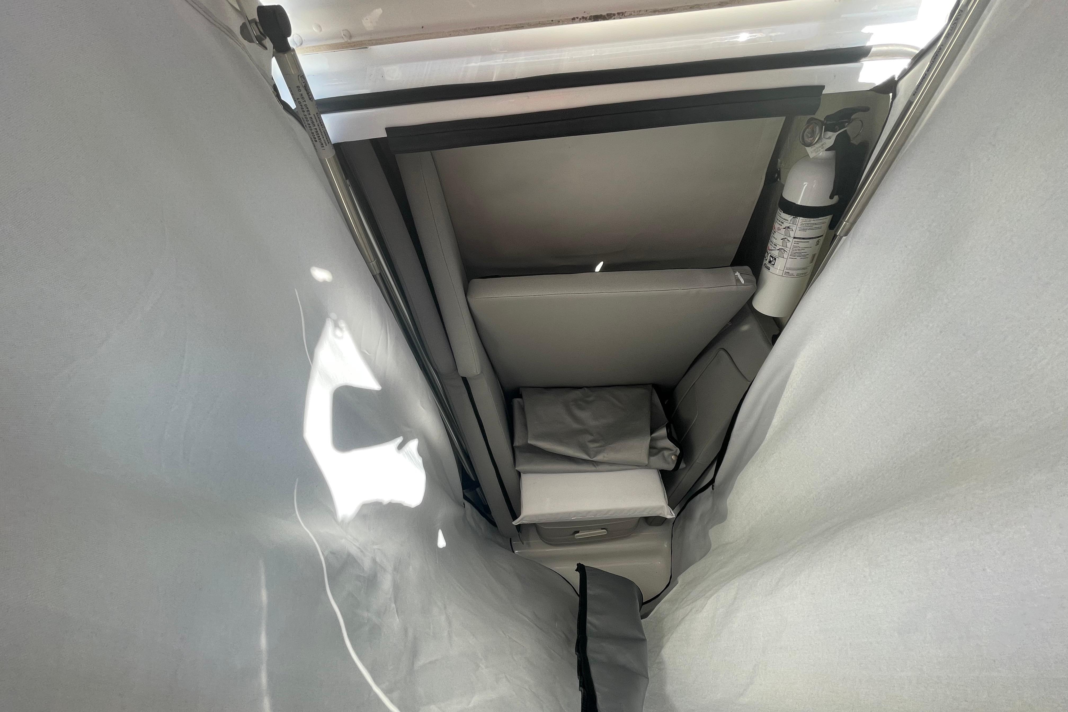 Interior view of 2022 Wellcraft 202 Fisherman boat, featuring storage and safety equipment.