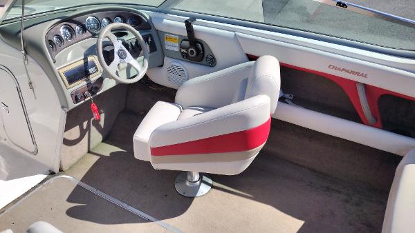 1999 Chaparral 2130 SS boat interior with steering wheel and captain's chair.