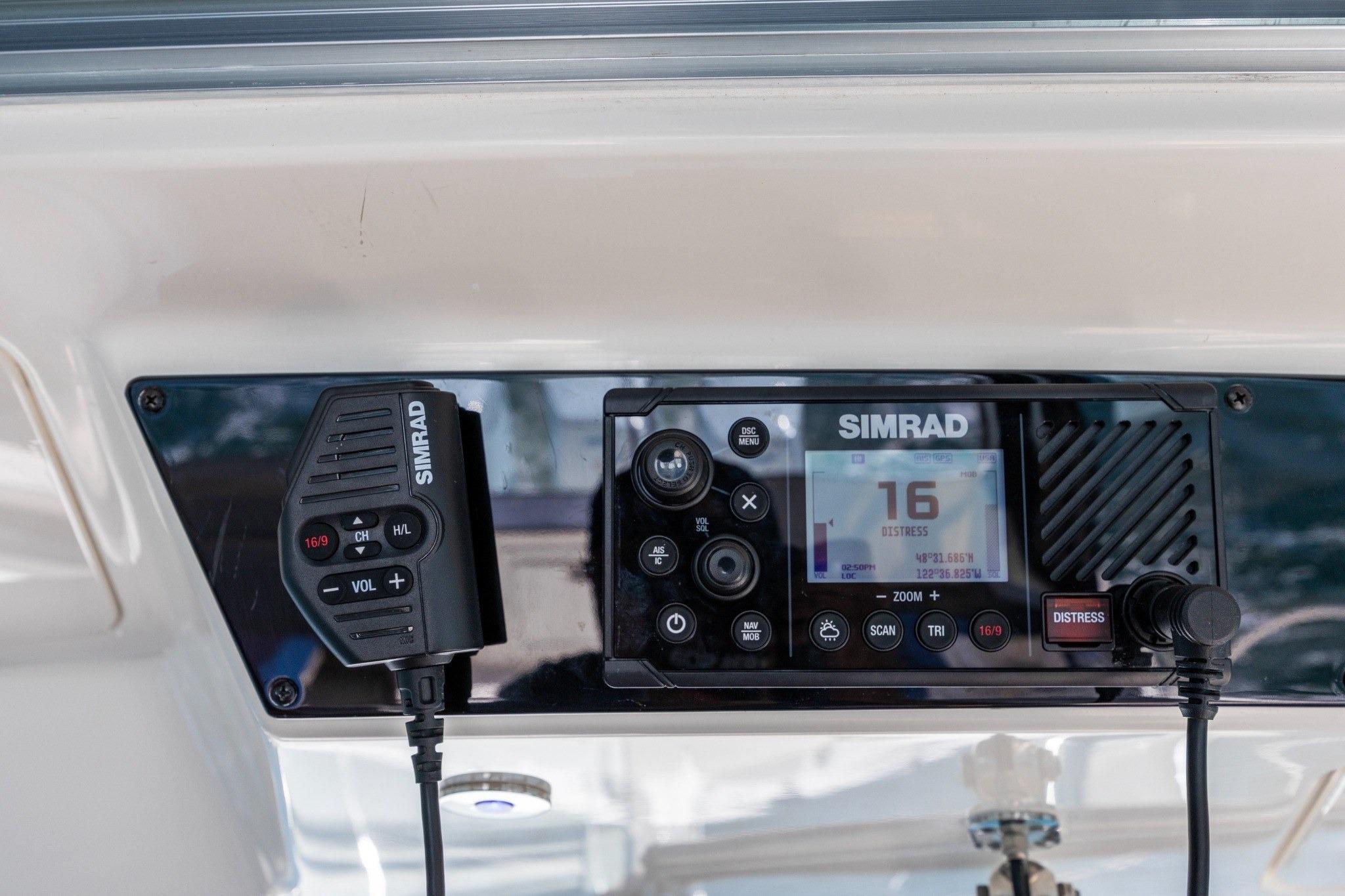 Simrad marine radio system on 2023 Boston Whaler 405 Conquest boat dashboard.