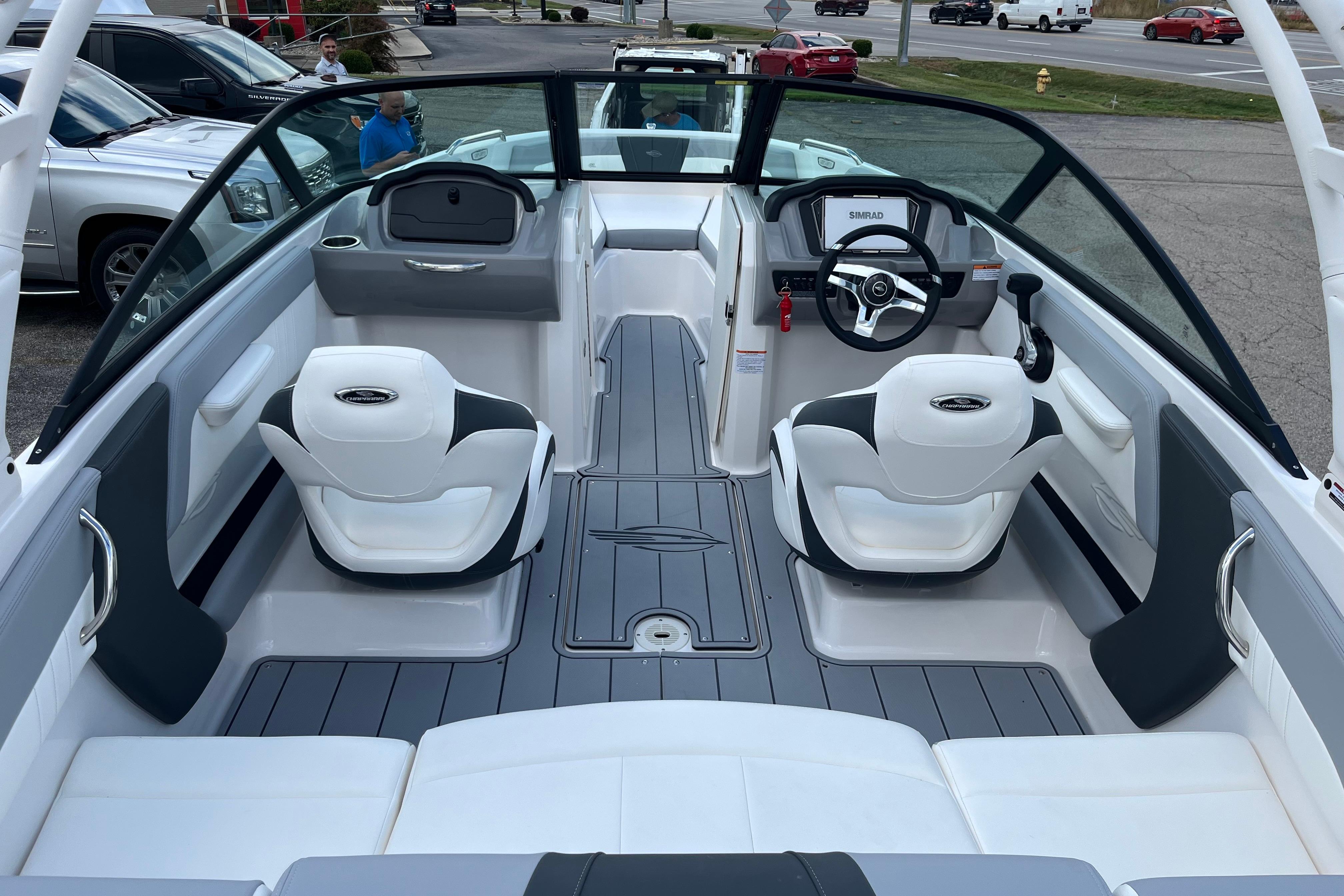 Interior of 2026 Chaparral 21 SSi boat with modern seating and steering wheel.
