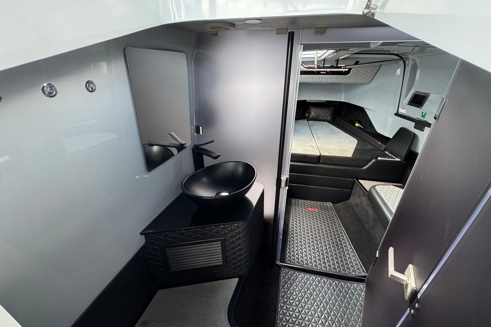 Luxurious interior of 2023 BRABUS Shadow 900 ST, featuring modern bathroom and cozy cabin space.