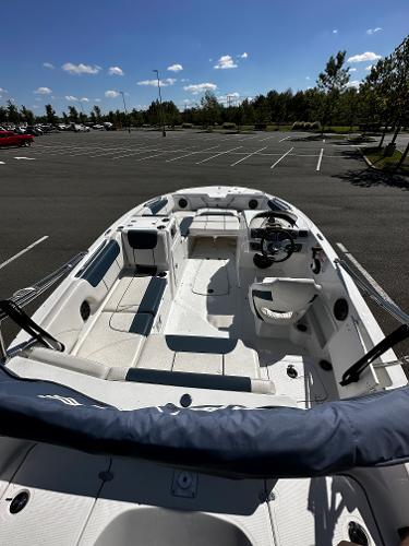 2023 Tahoe 1950 boat in an empty parking lot.
