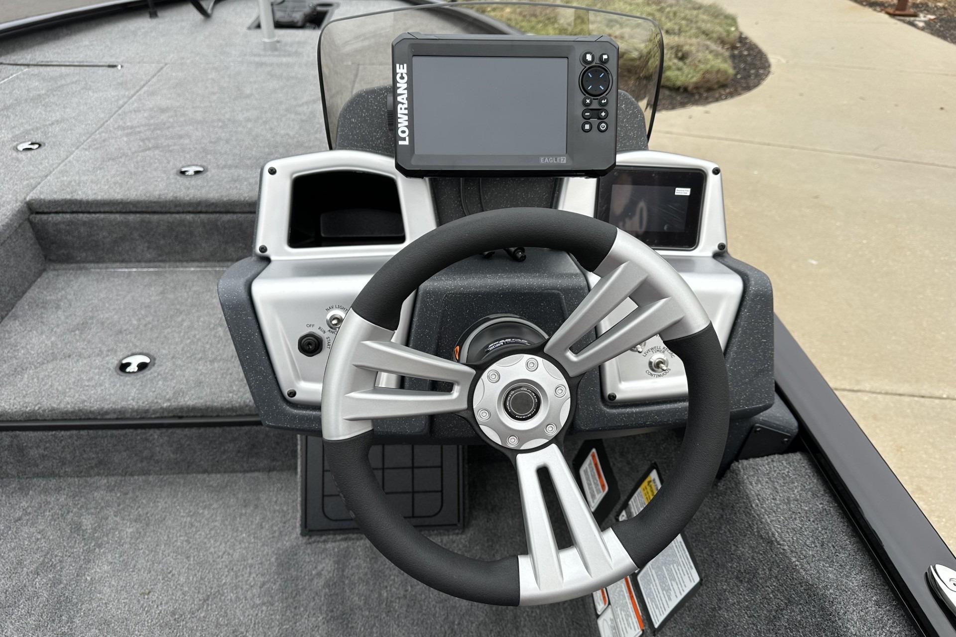 Steering console of 2025 Tracker Savage 215 boat with navigation display.