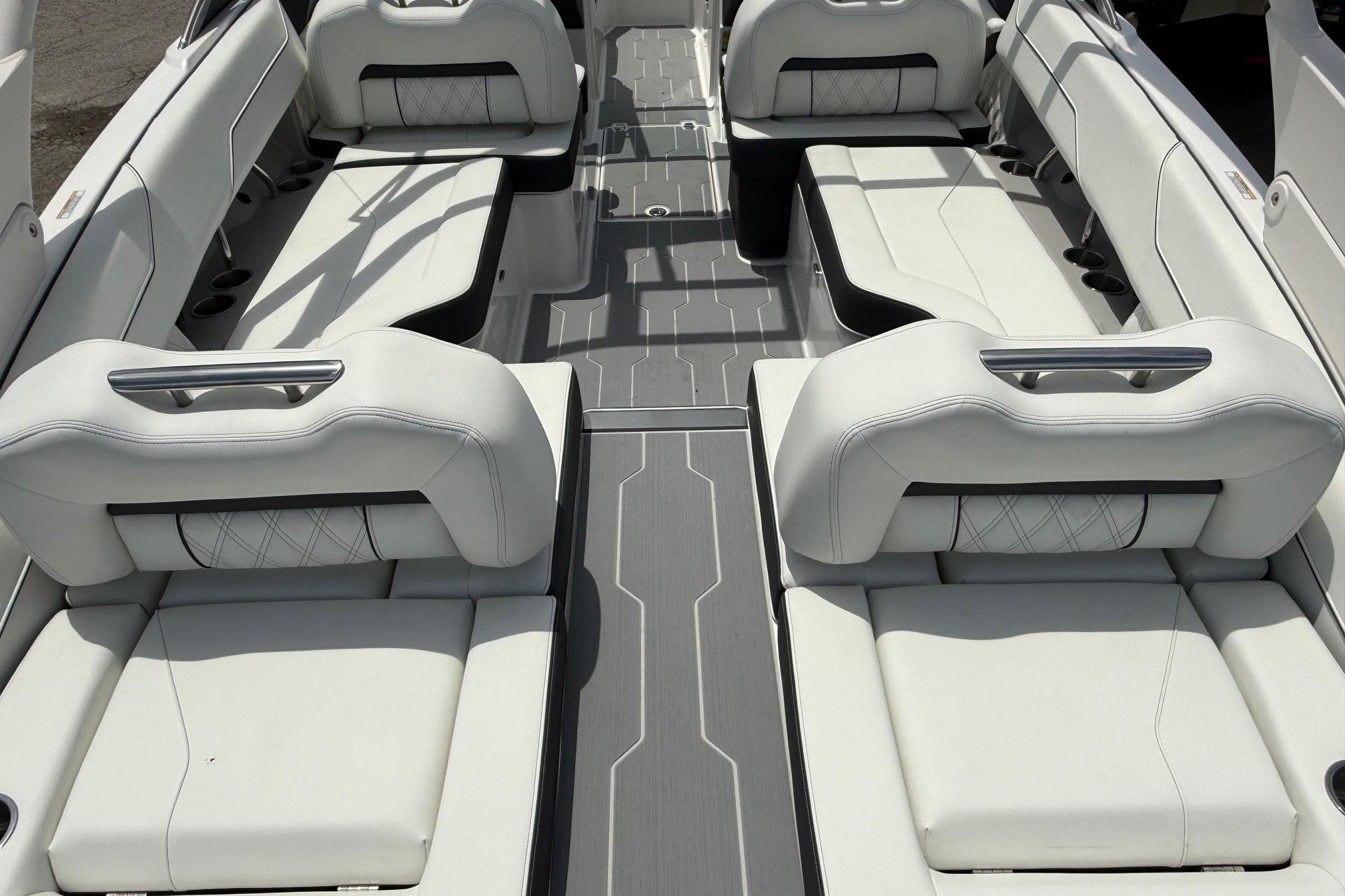 Luxurious interior of 2026 Regal LS4 Surf boat with white seating and modern design.