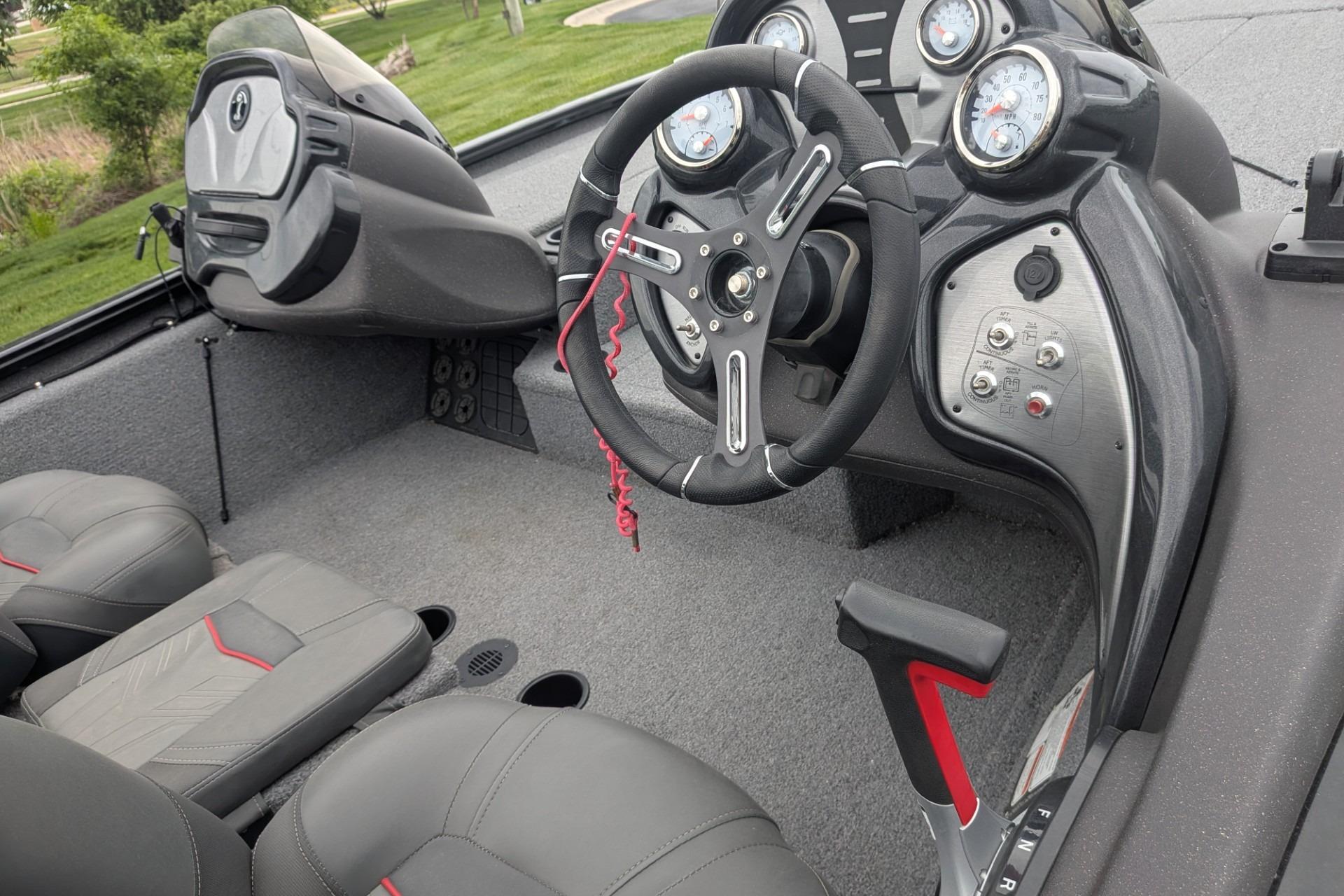 2023 Tracker Pro Team 195 TXW Tournament Edition boat interior with steering wheel and dashboard.