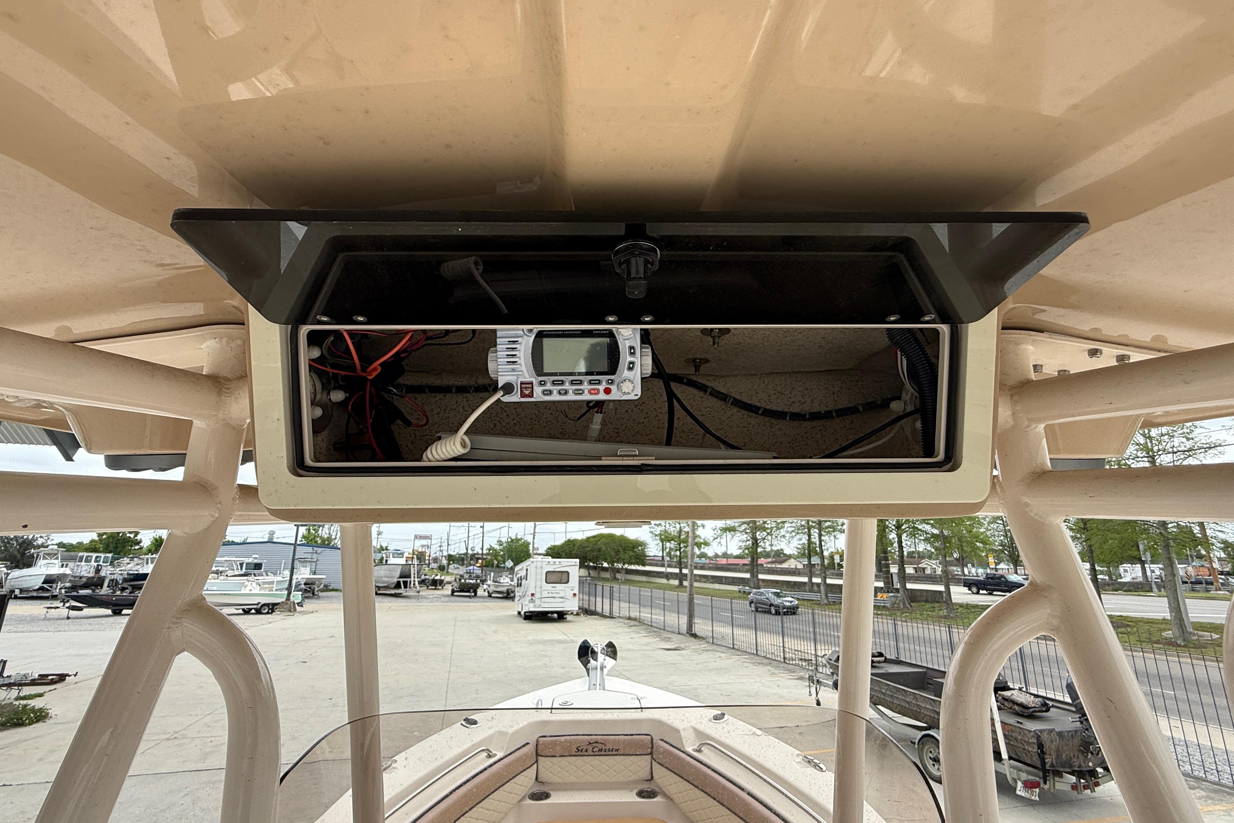 2023 SeaChaser 24 HFC boat console with electronic equipment and wiring.
