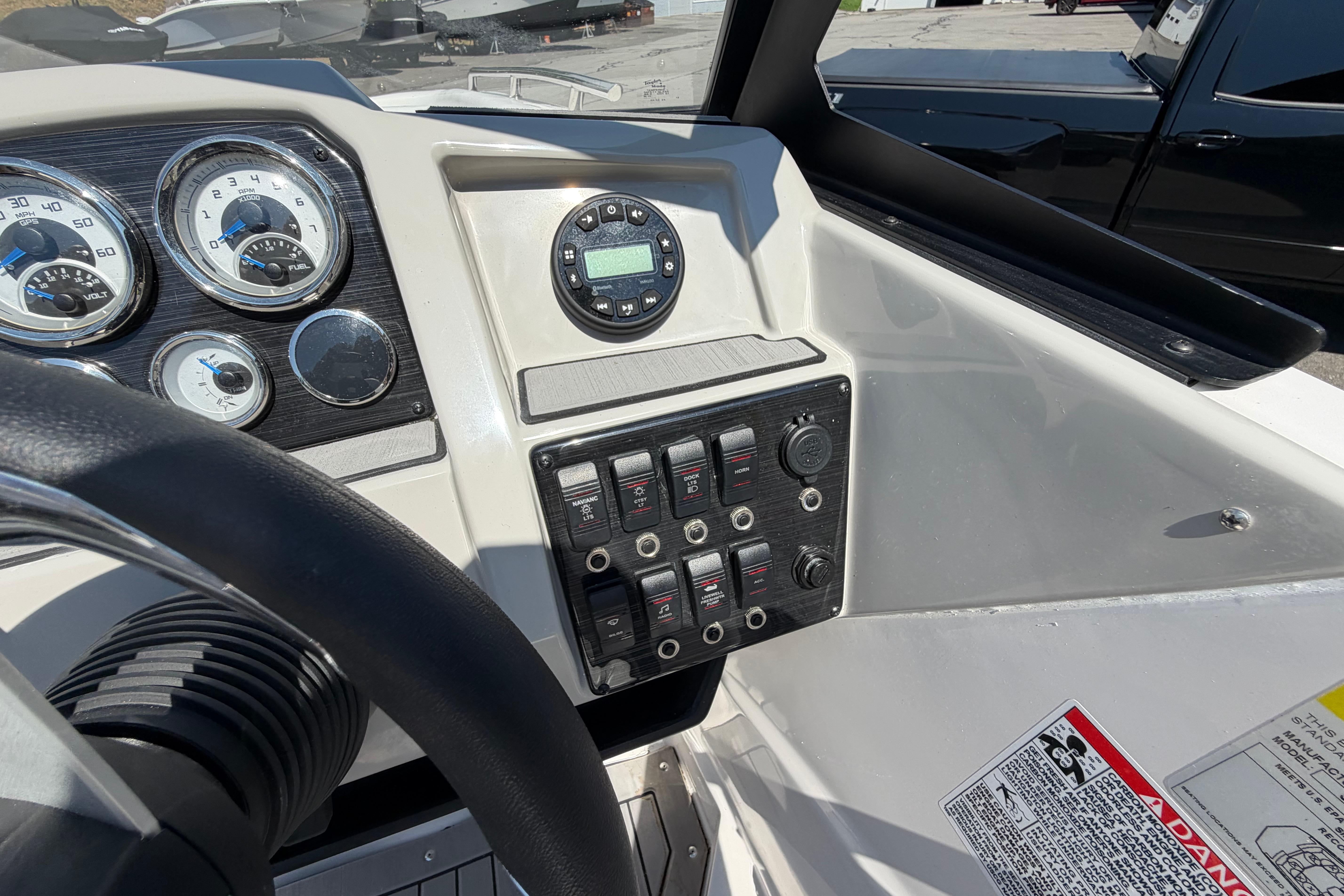 Dashboard of 2025 Starcraft SVX 190 OB boat with gauges and controls.