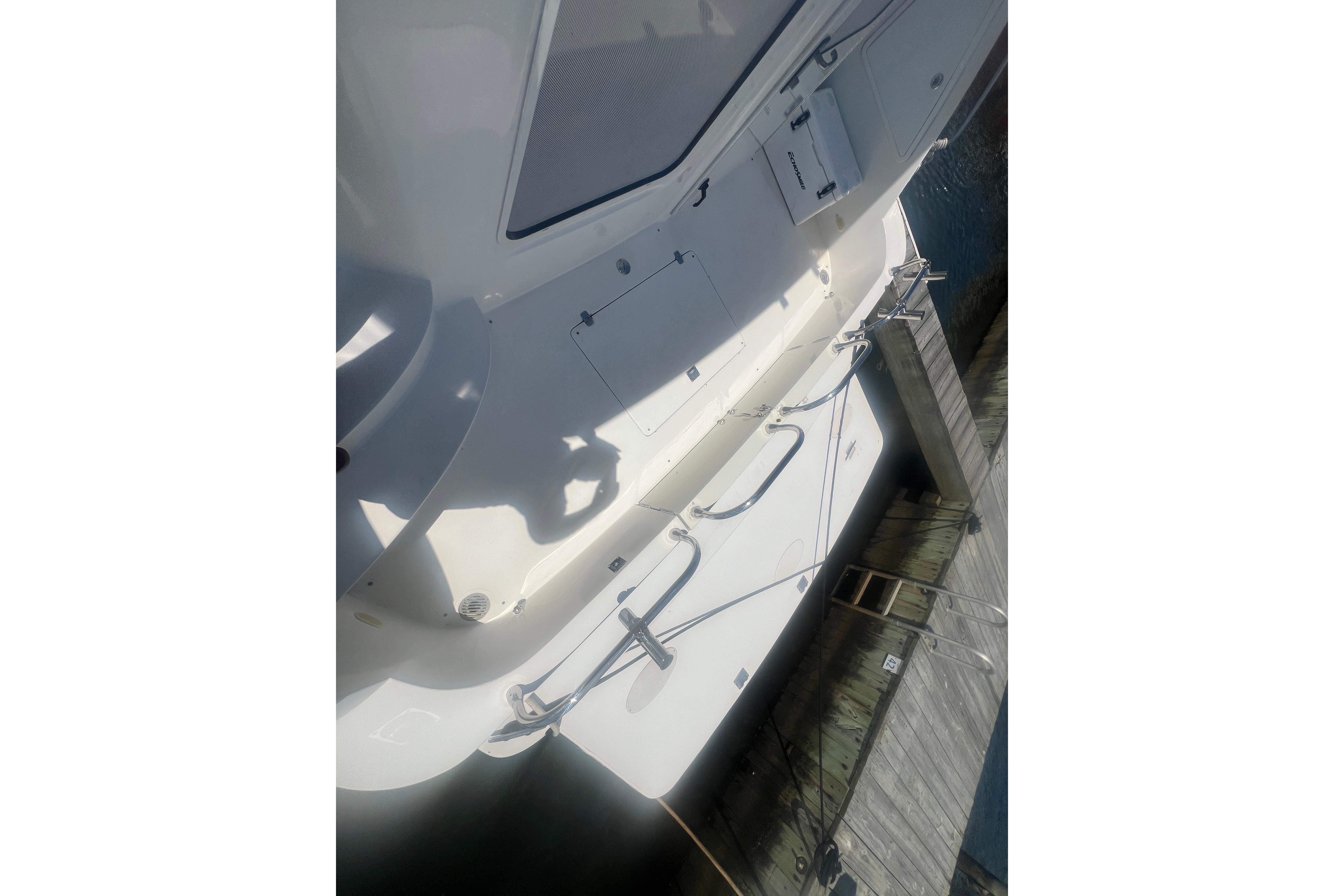 2006 Carver 43 Motor Yacht docked, showing deck details and mooring lines.