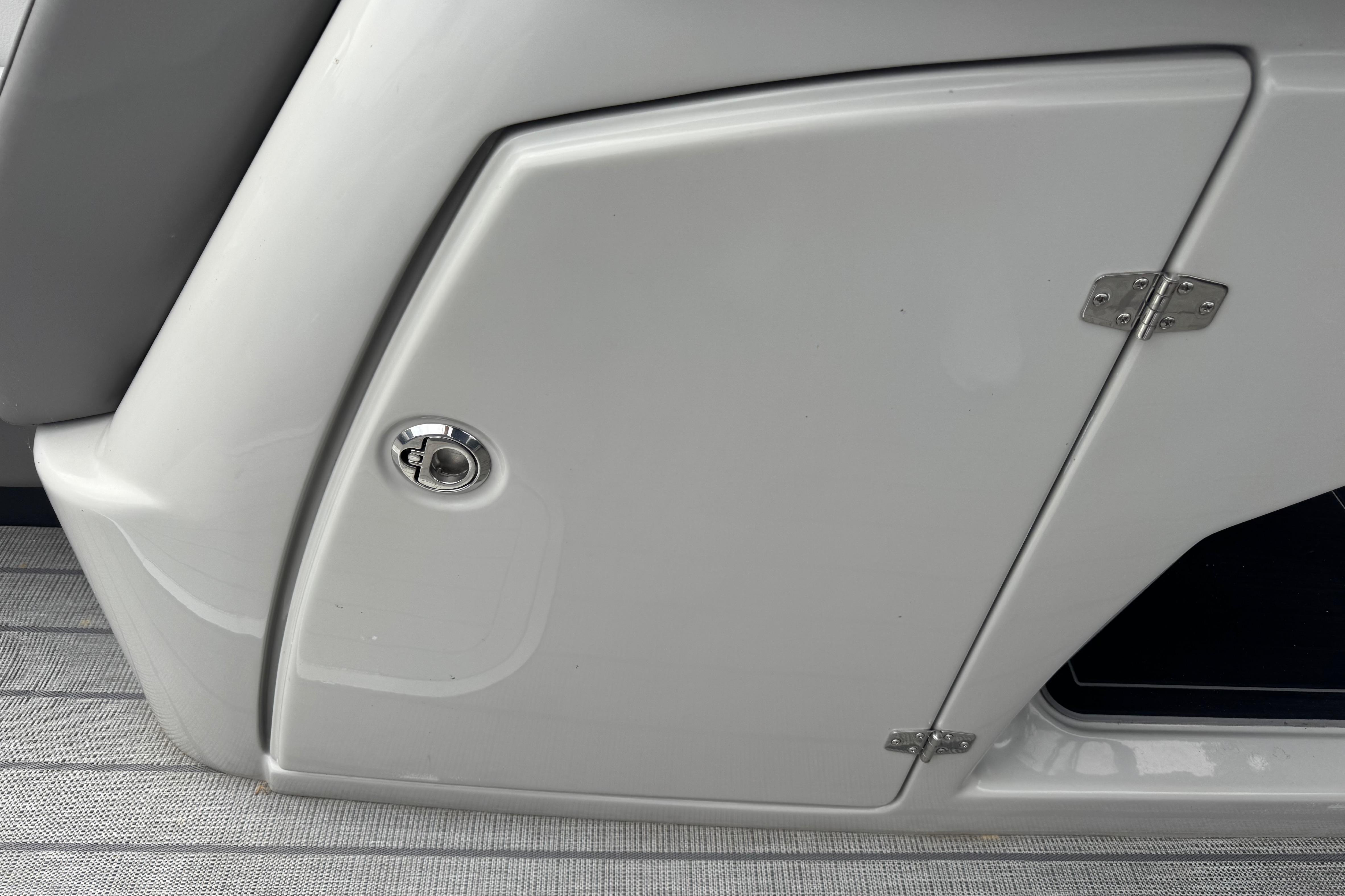 2023 Starcraft MX 25 DL DH boat storage compartment with sleek design and secure latch.