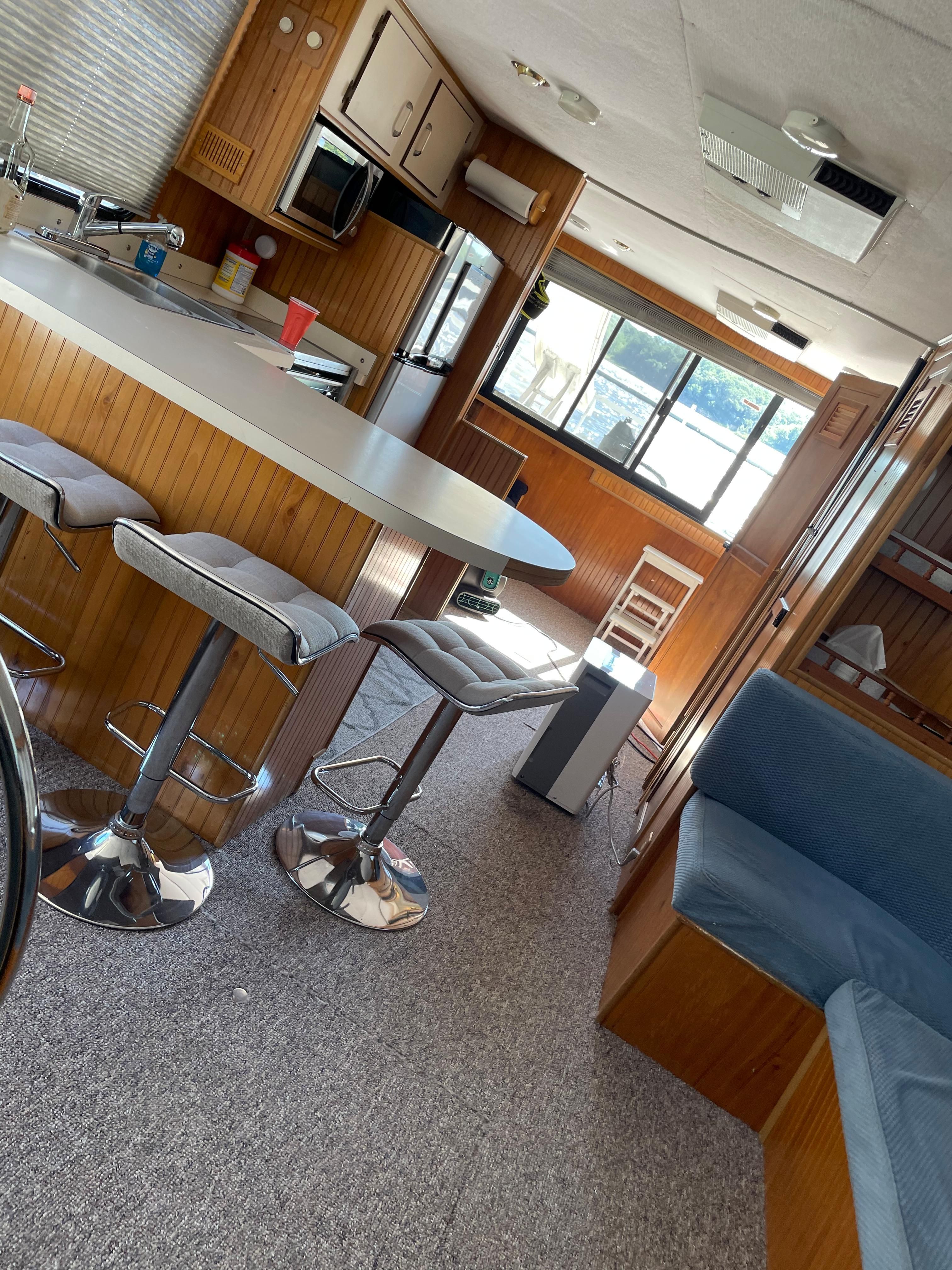 Interior of a 1993 Gibson Sport Series with kitchen and seating area.