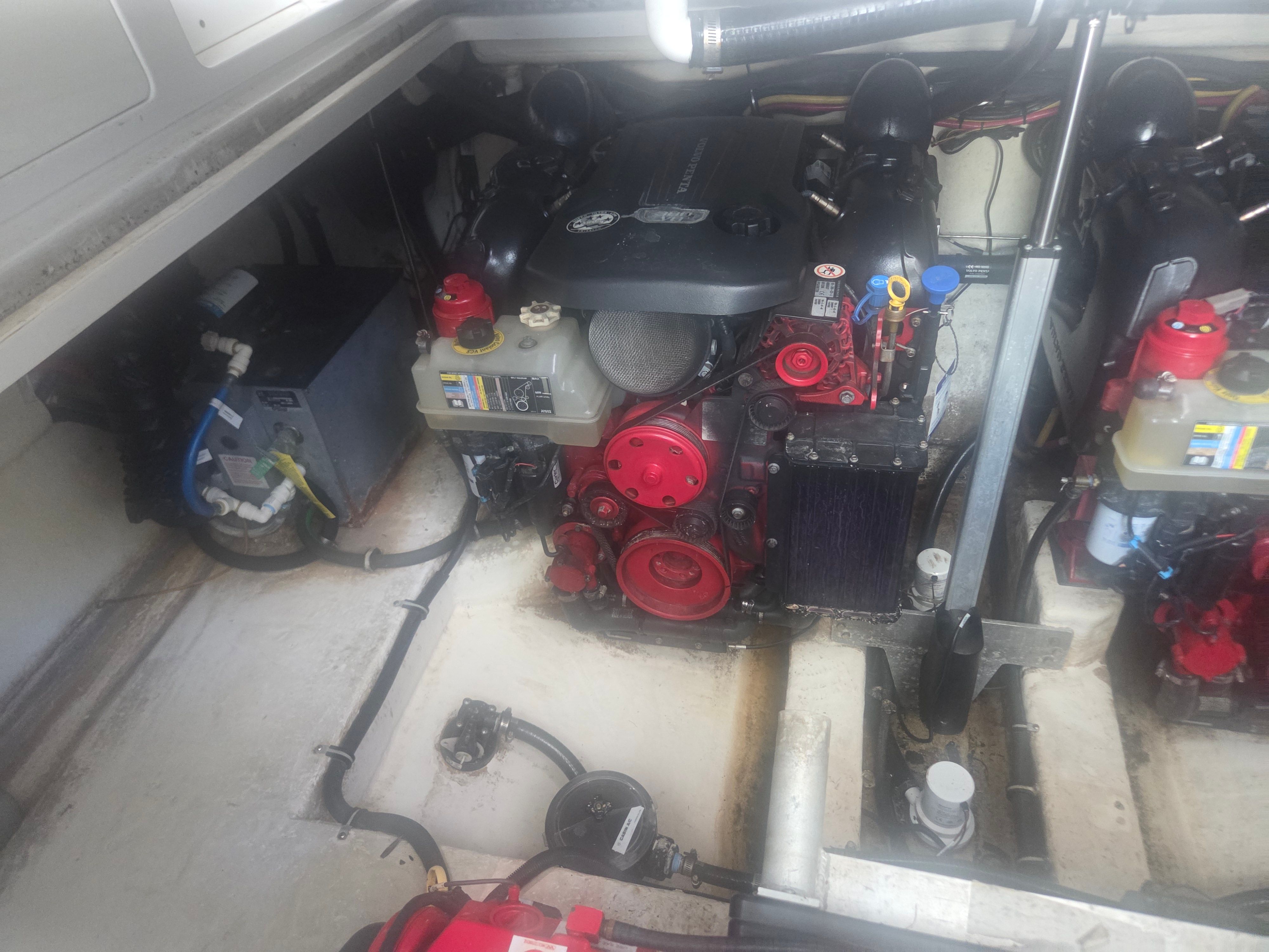 Engine compartment of a 2019 Monterey 360SC boat with red engine.