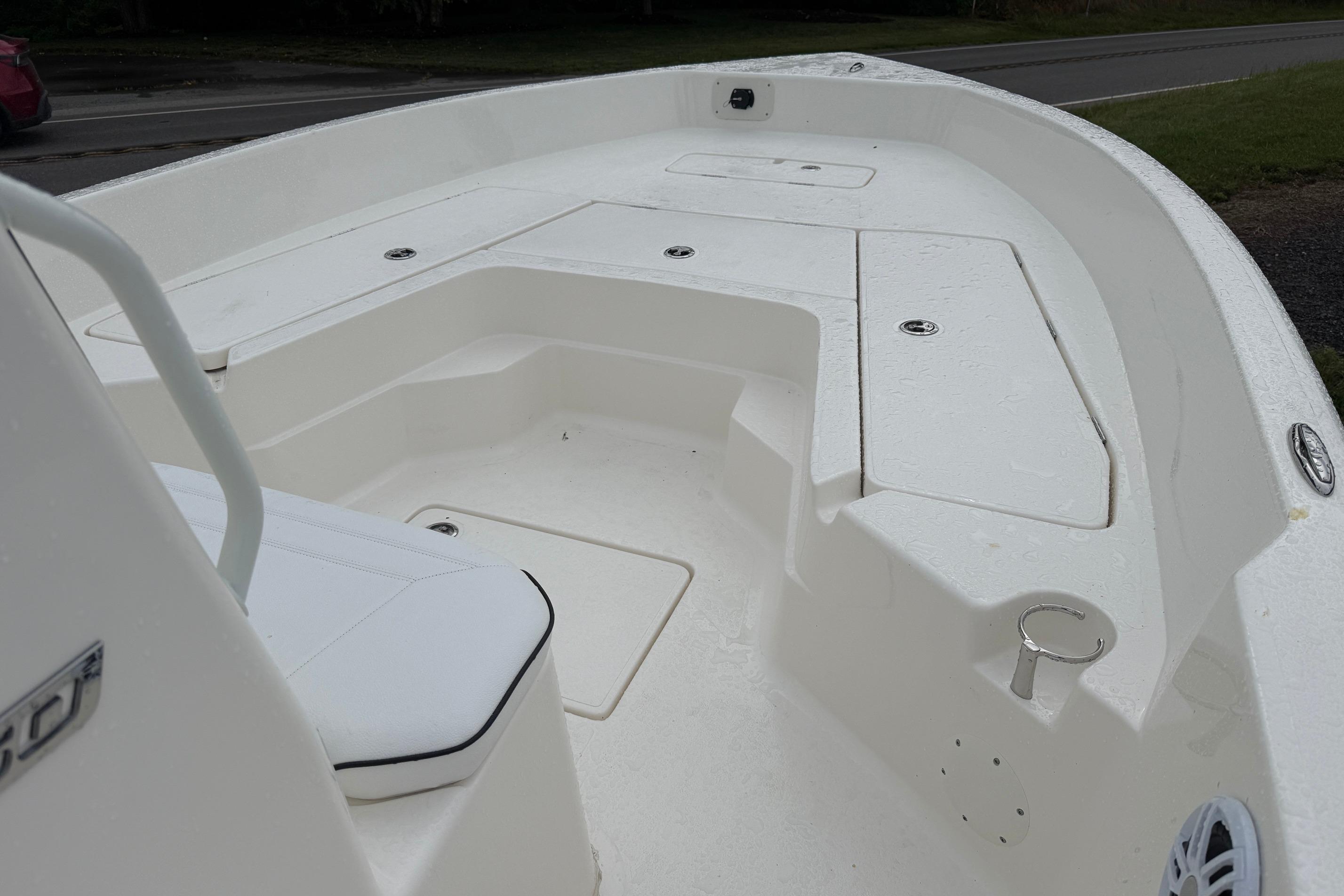 2026 Skeeter SX2350 boat interior with white seating and storage compartments.