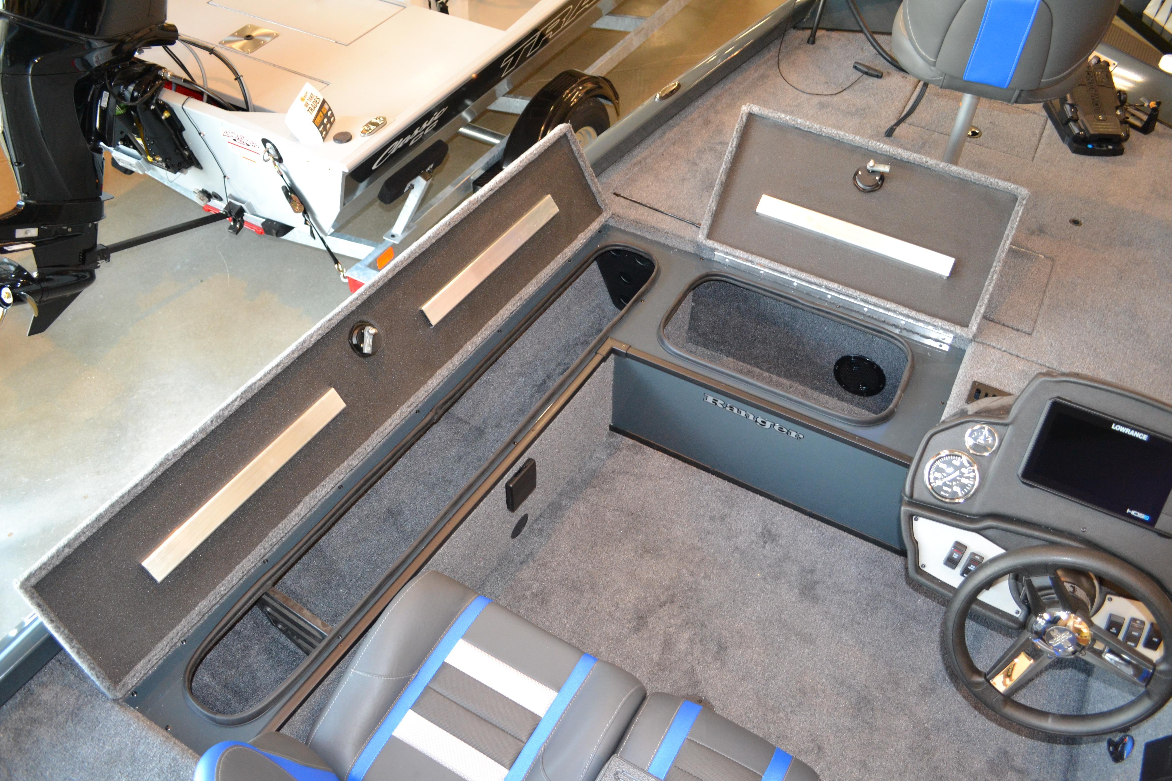 2026 Ranger RT178C boat interior with storage compartments and steering console.