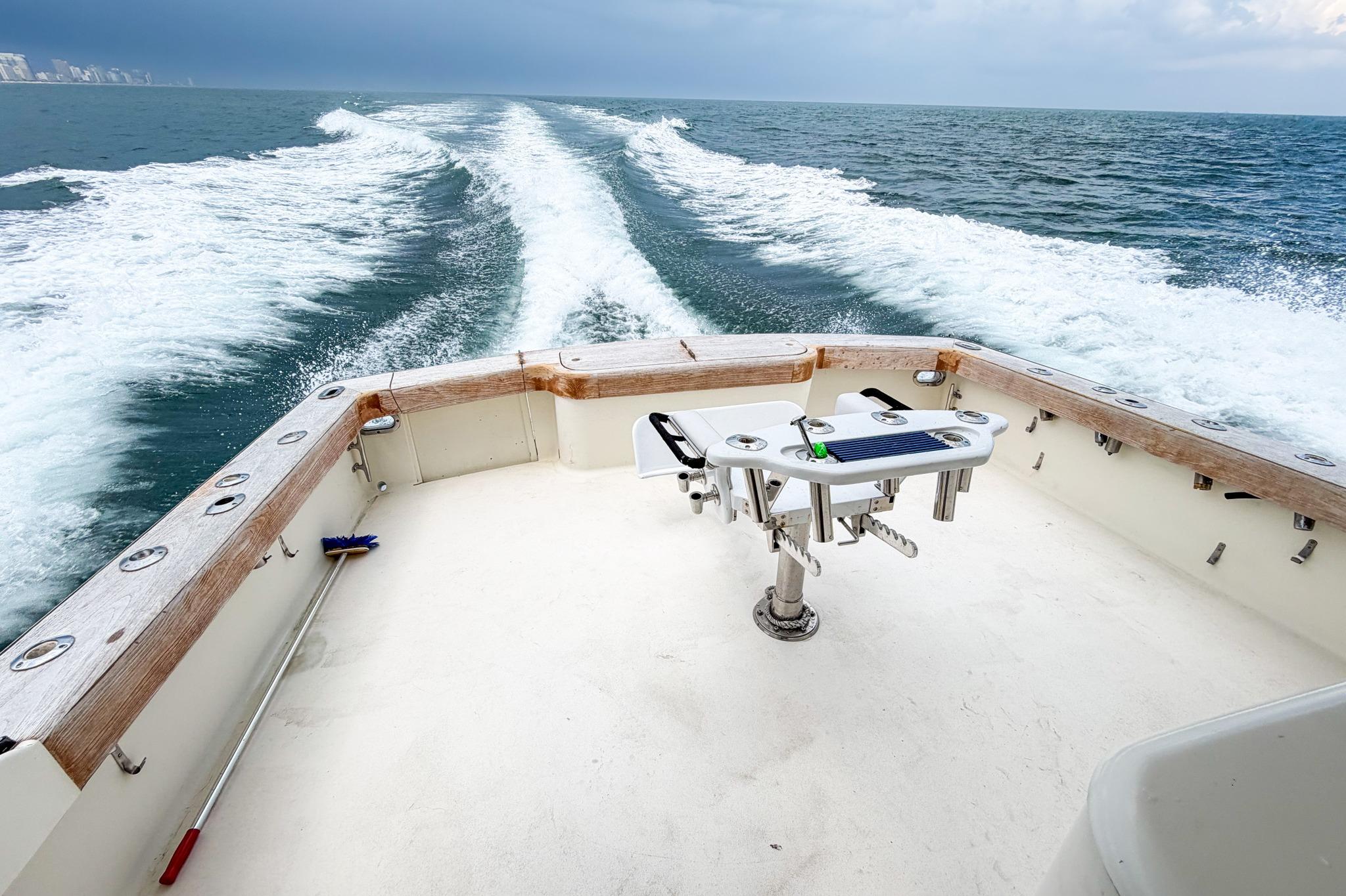 1998 Blackwell Custom Carolina Sportfish boat cruising on open water, leaving a wake behind.