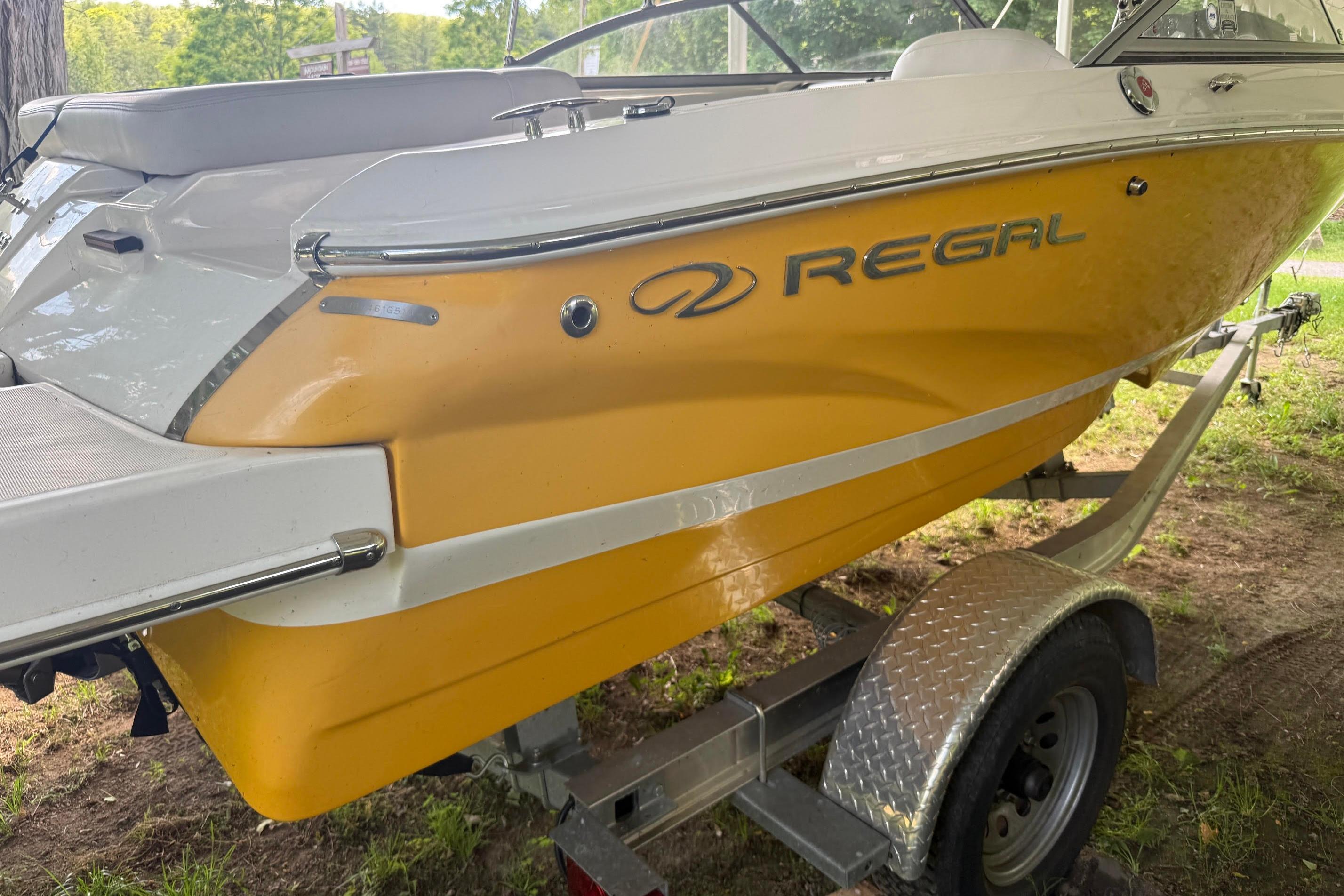 2016 Regal 1900 ES Bowrider boat on trailer, yellow and white exterior.