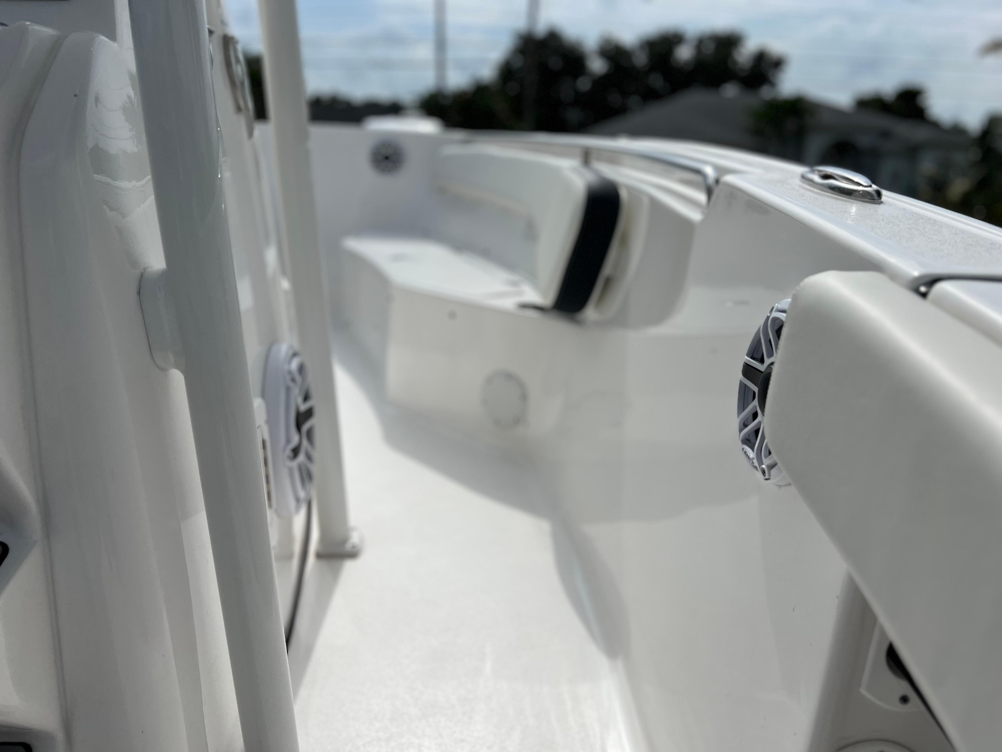 2023 Tidewater 220 CC Adventure boat interior with seating and speakers.