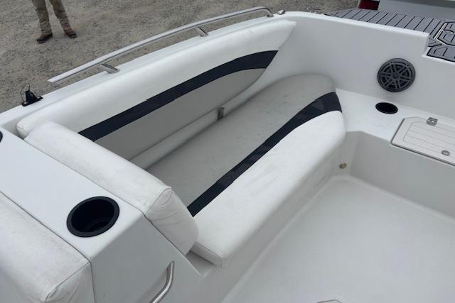 2021 Starcraft SVX 171 OB boat interior with white seating and cup holders.