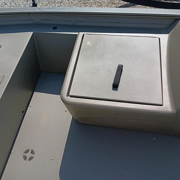2025 Tracker Grizzly 1754 SC boat interior with storage compartment and durable flooring.