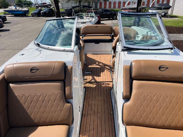 2024 Crownline Eclipse E255 boat with tan leather seats and sleek design.